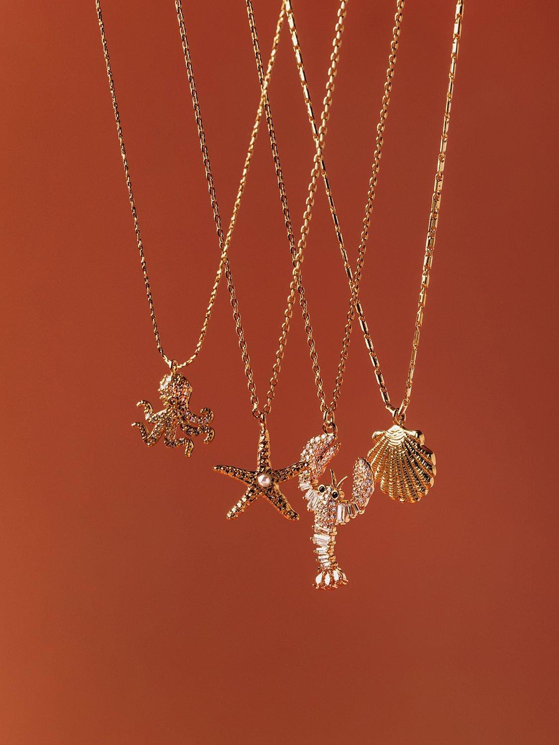 Product image 4 of 5, which shows Orelia Starfish and Pearl Charm Necklace, Gold