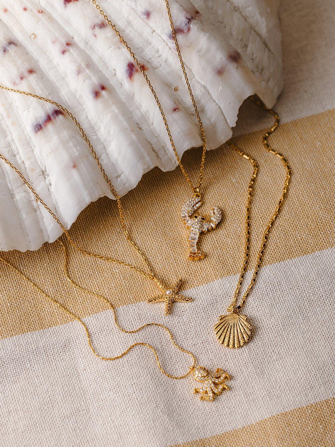 Product image 5 of 5, which shows Orelia Starfish and Pearl Charm Necklace, Gold