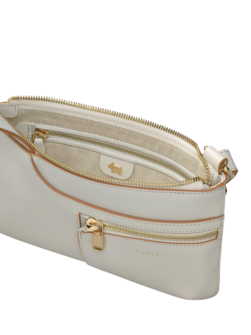 Product image 3 of 5, which shows Radley Pockets Leather Mini Zip Top Cross Body Bag, Chalk