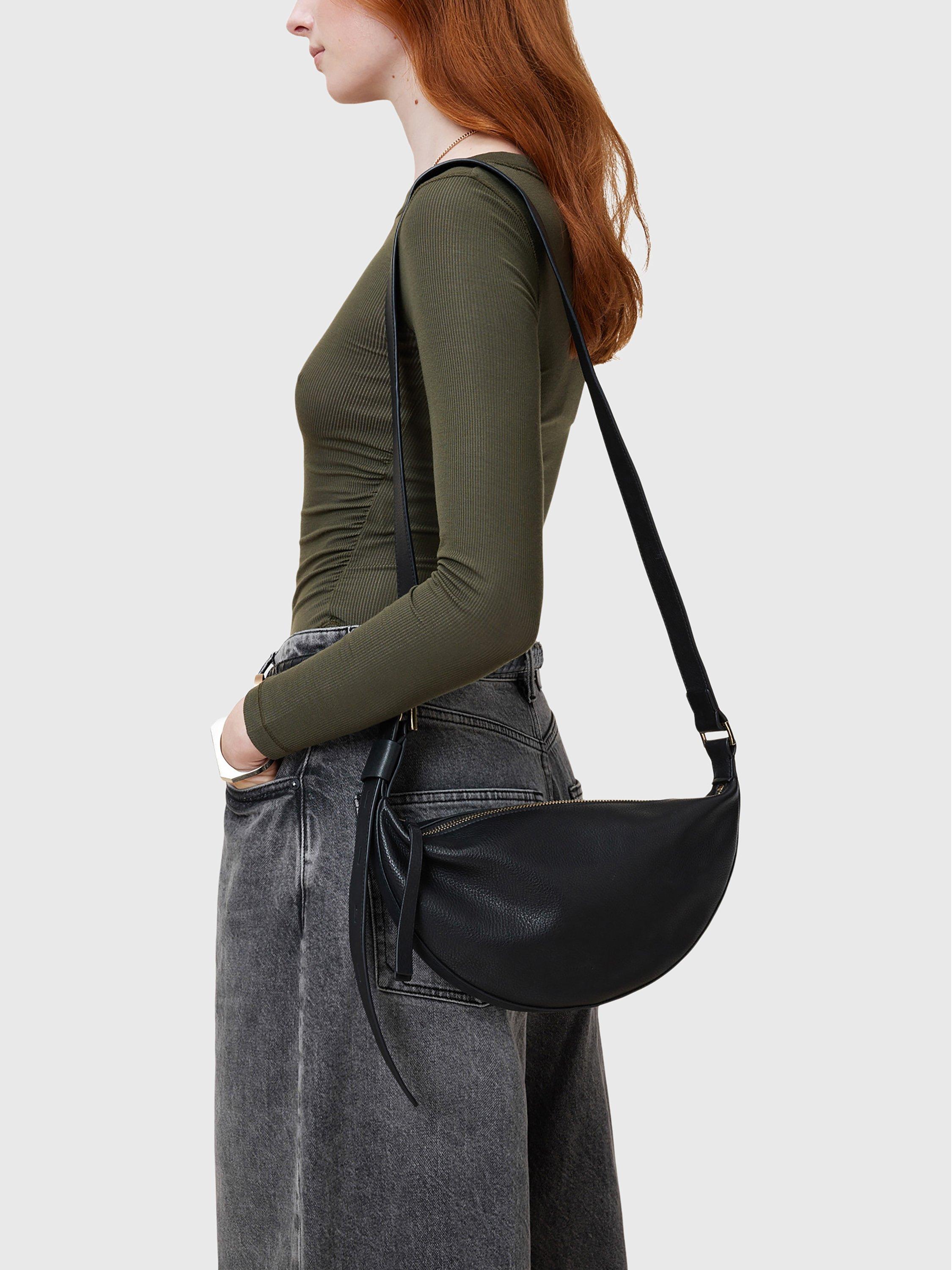 Product image 2 of 7, which shows AllSaints Half Moon Cross Body Bag, Black