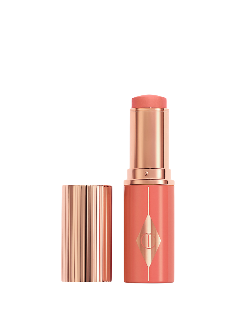 Product image 1 of 8, which shows Charlotte Tilbury Unreal Blush Healthy Glow Stick, Peachy Glow