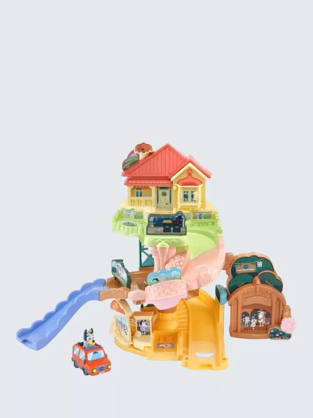 Toy playset featuring a colourful house with a slide and a small car. Ideal for imaginative play.