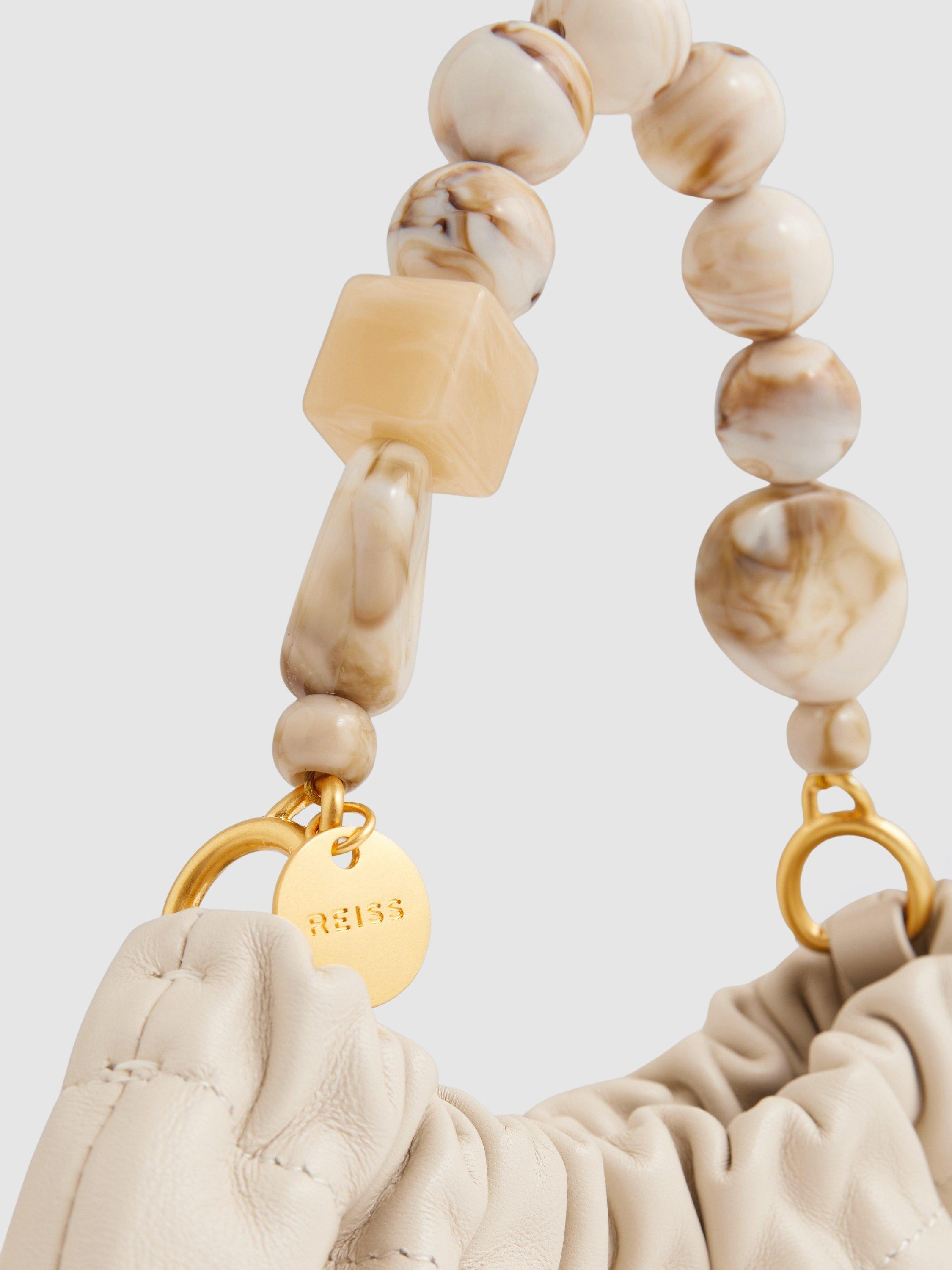 Product image 2 of 5, which shows Reiss Erin Leather Bead Handle Bag, Off White