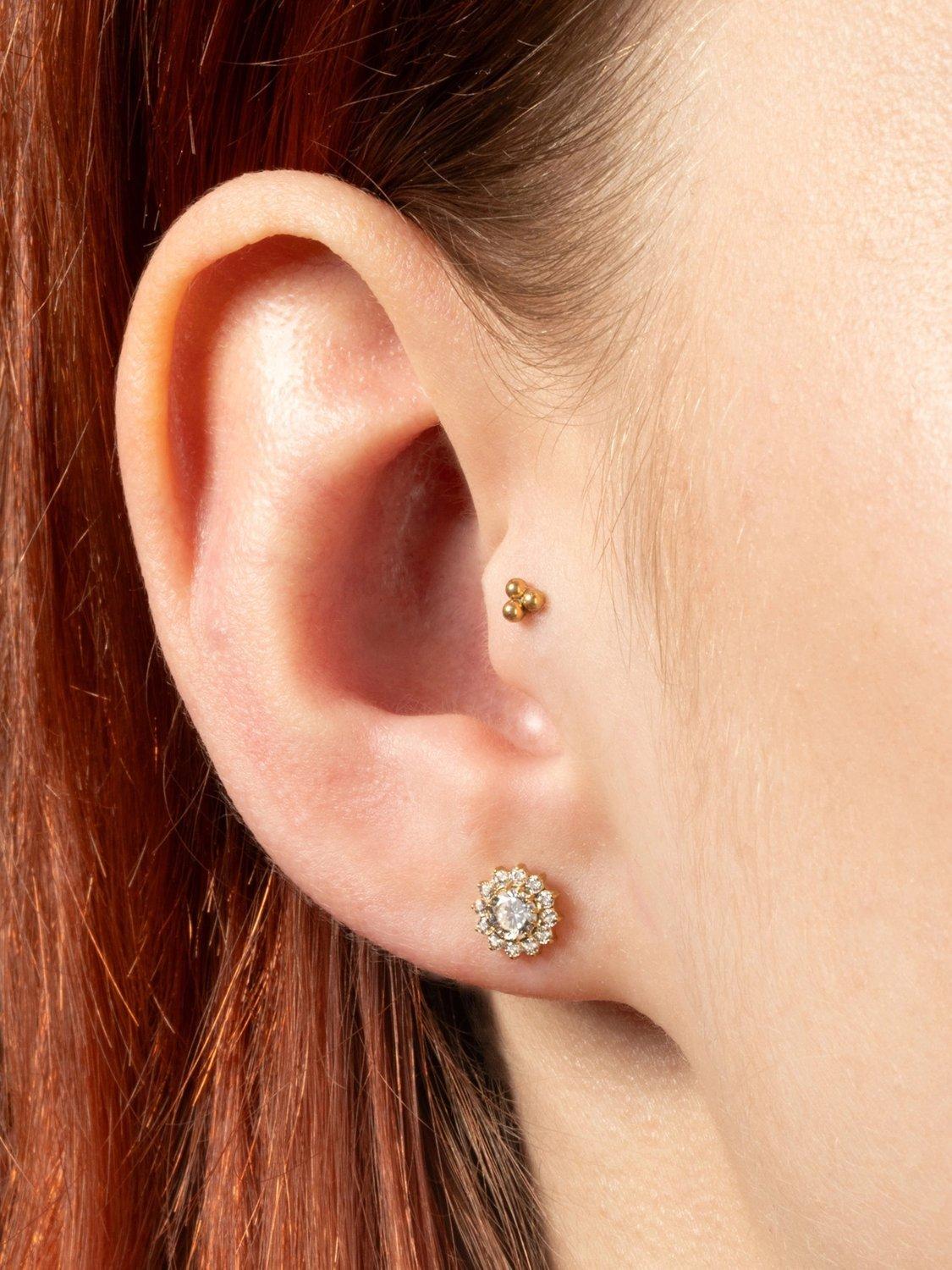 Product image 2 of 4, which shows Tish Lyon Gold Titanium Jewelled Flower Stud Earrings