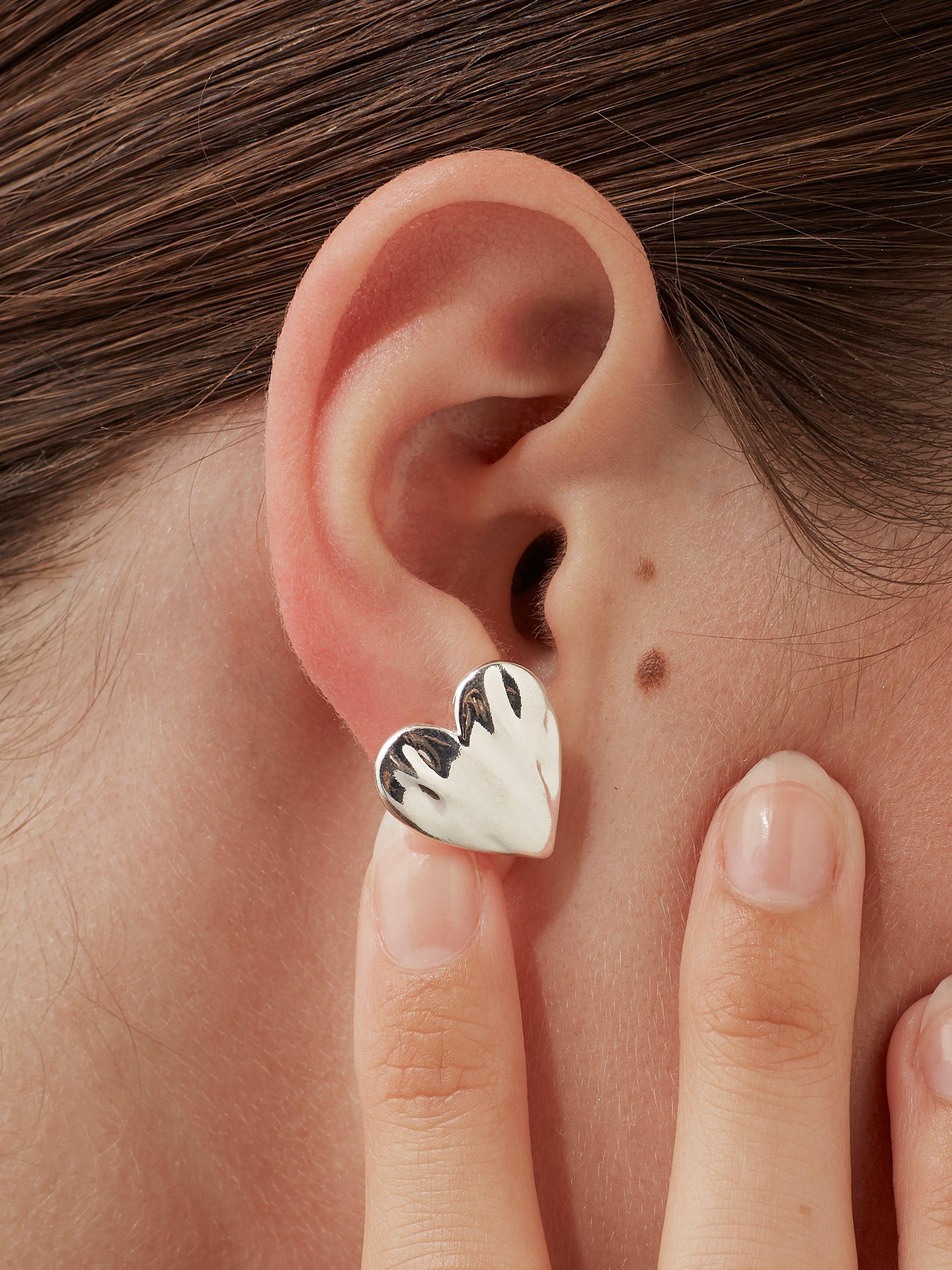 Product image 2 of 3, which shows Estella Bartlett Oversized Molten Heart Stud Earrings, Silver