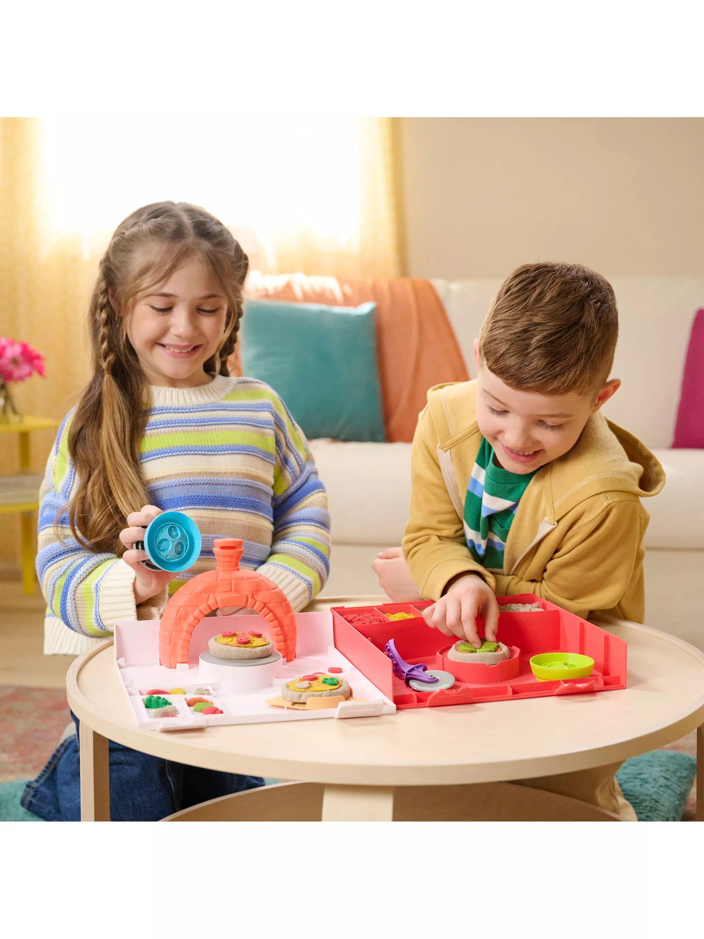 two children building toys