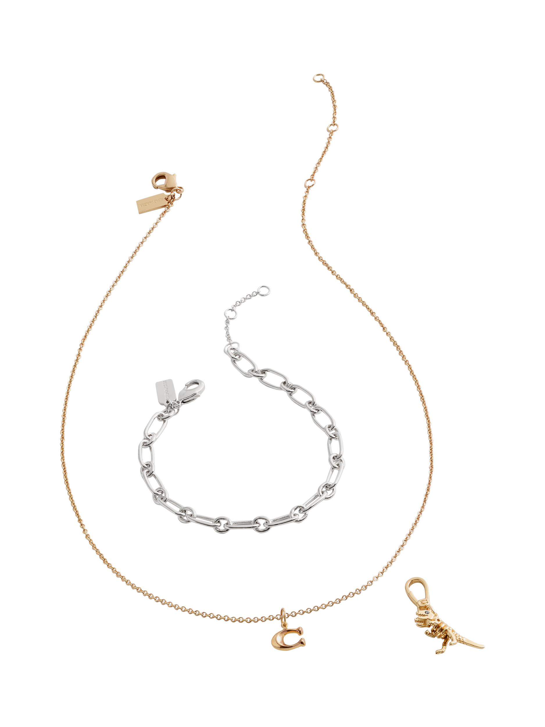 Product image 4 of 7, which shows Coach Rexy Dino Motif Charm, Gold