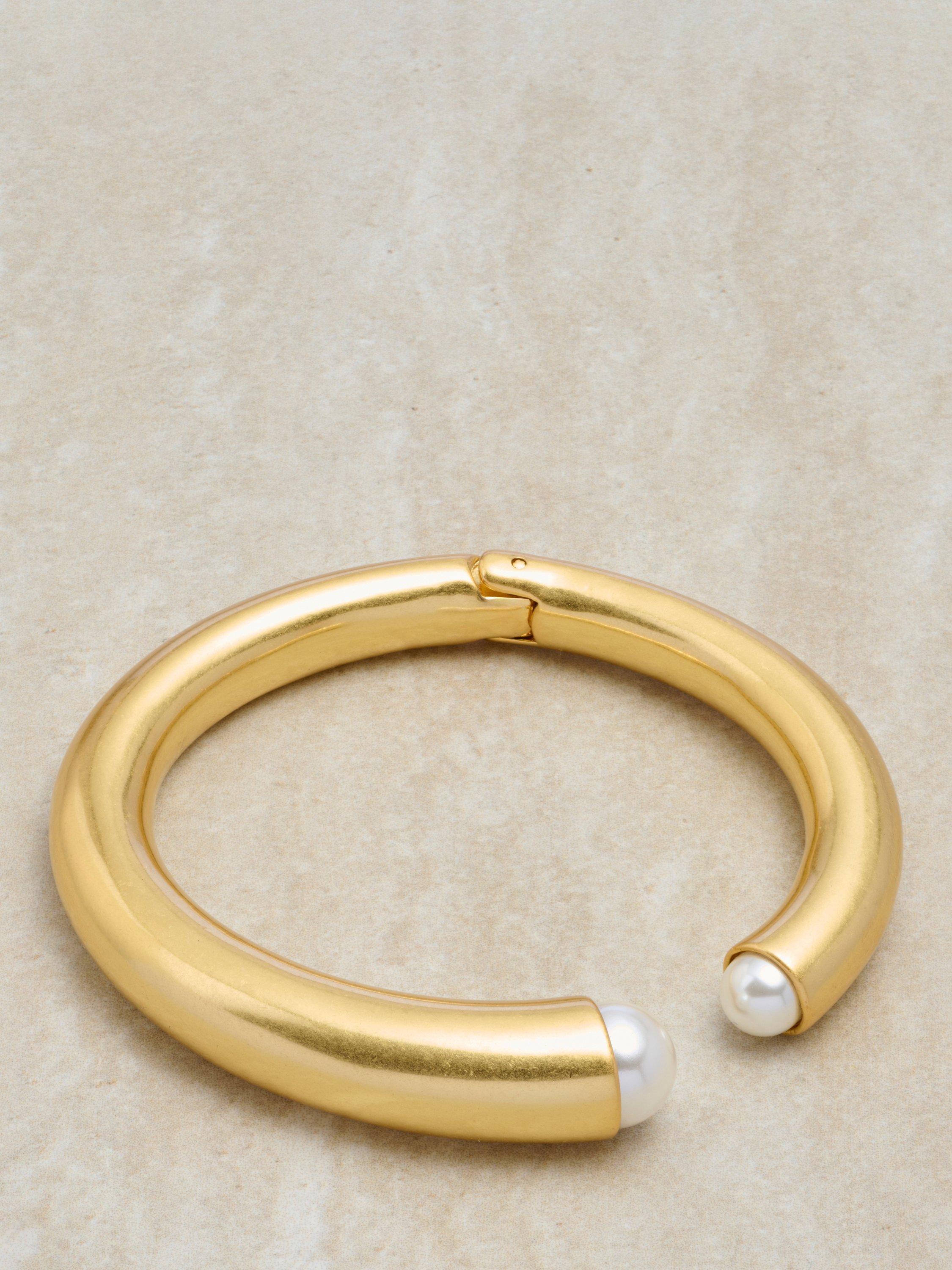 Product image 5 of 6, which shows Reiss Alana Curve Pearl Cuff Bangle, Gold