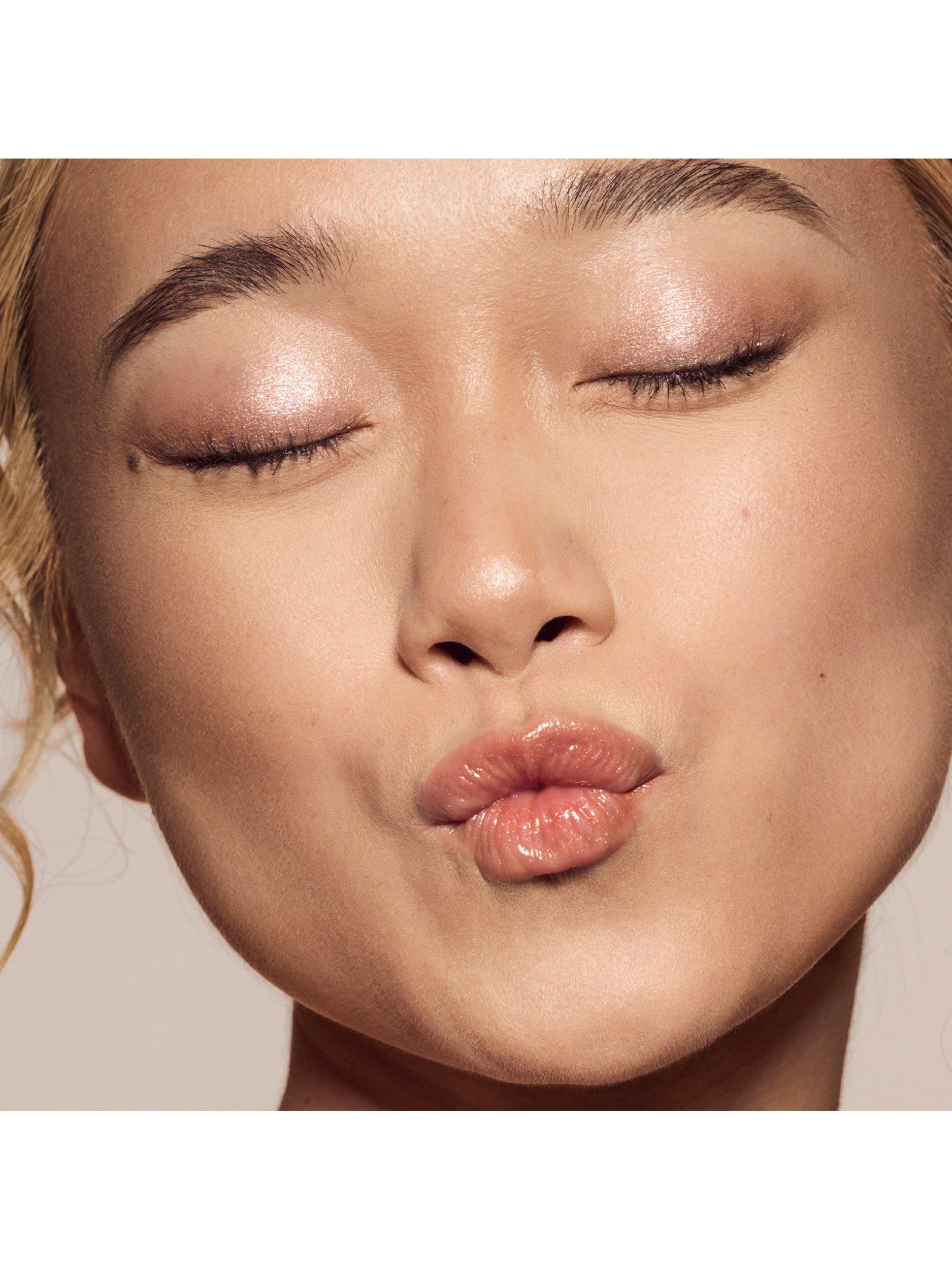 Product image 3 of 8, which shows Fenty Beauty Gloss Bomb Universal Lip Luminiser, Fenty Glow