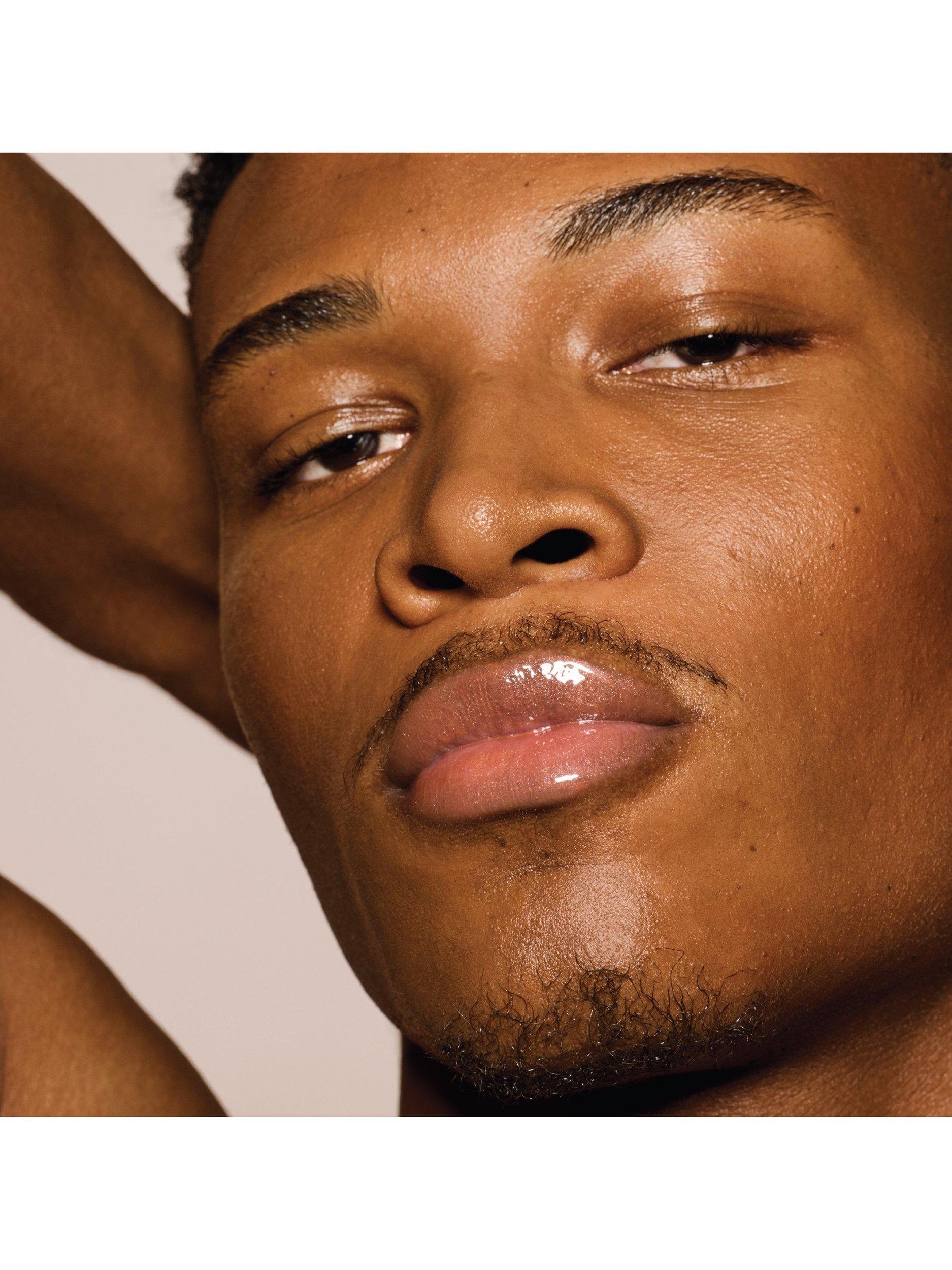 Product image 6 of 8, which shows Fenty Beauty Gloss Bomb Universal Lip Luminiser, Fenty Glow