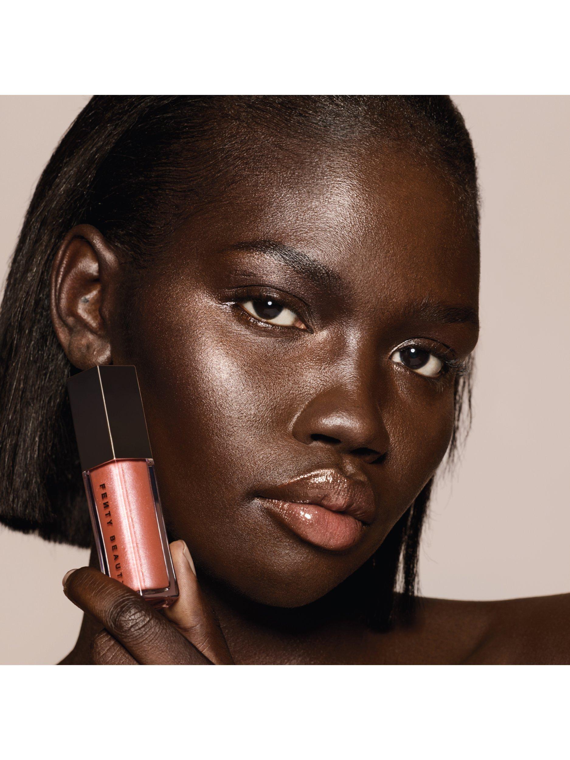 Product image 7 of 8, which shows Fenty Beauty Gloss Bomb Universal Lip Luminiser, Fenty Glow