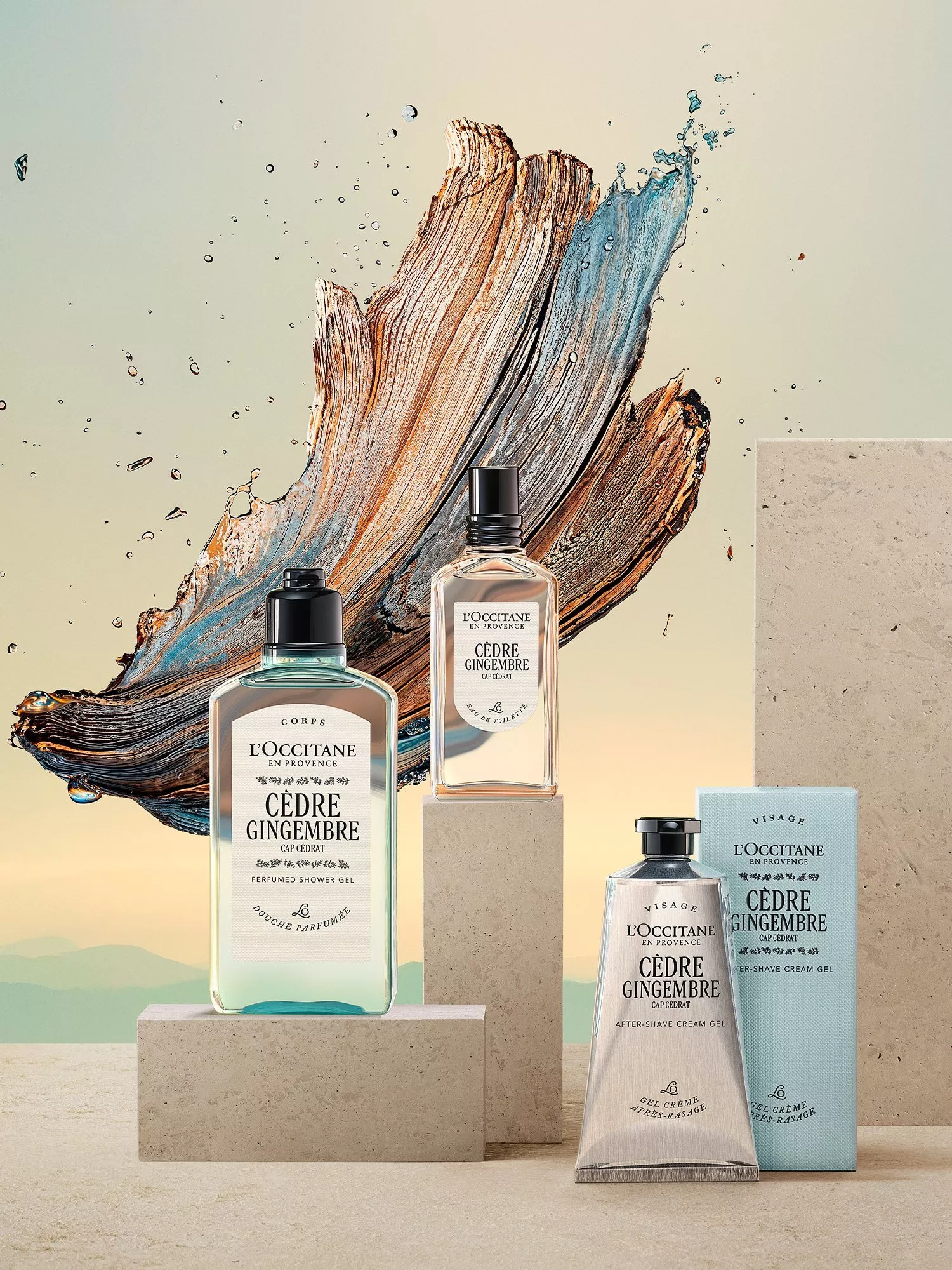 L’Occitane Cèdre Gingembre men’s fragrance set with shower gel, eau de toilette and aftershave on stone blocks