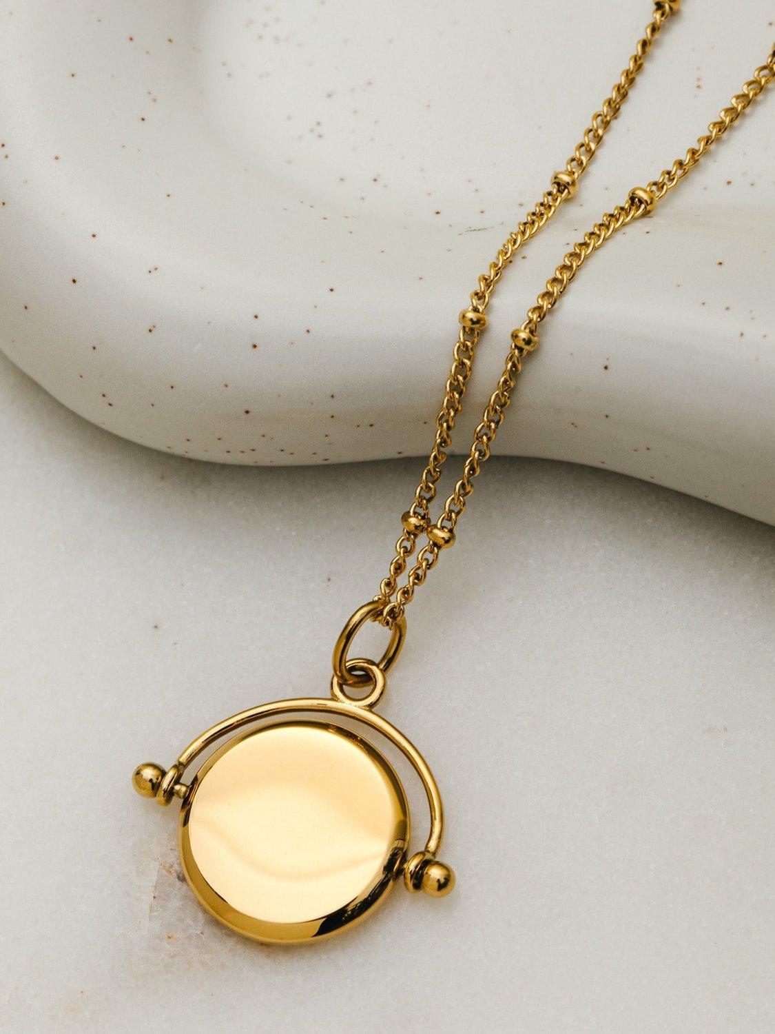Product image 4 of 4, which shows Orelia LUXE Faceted Disc Spinner Necklace, Pale Gold