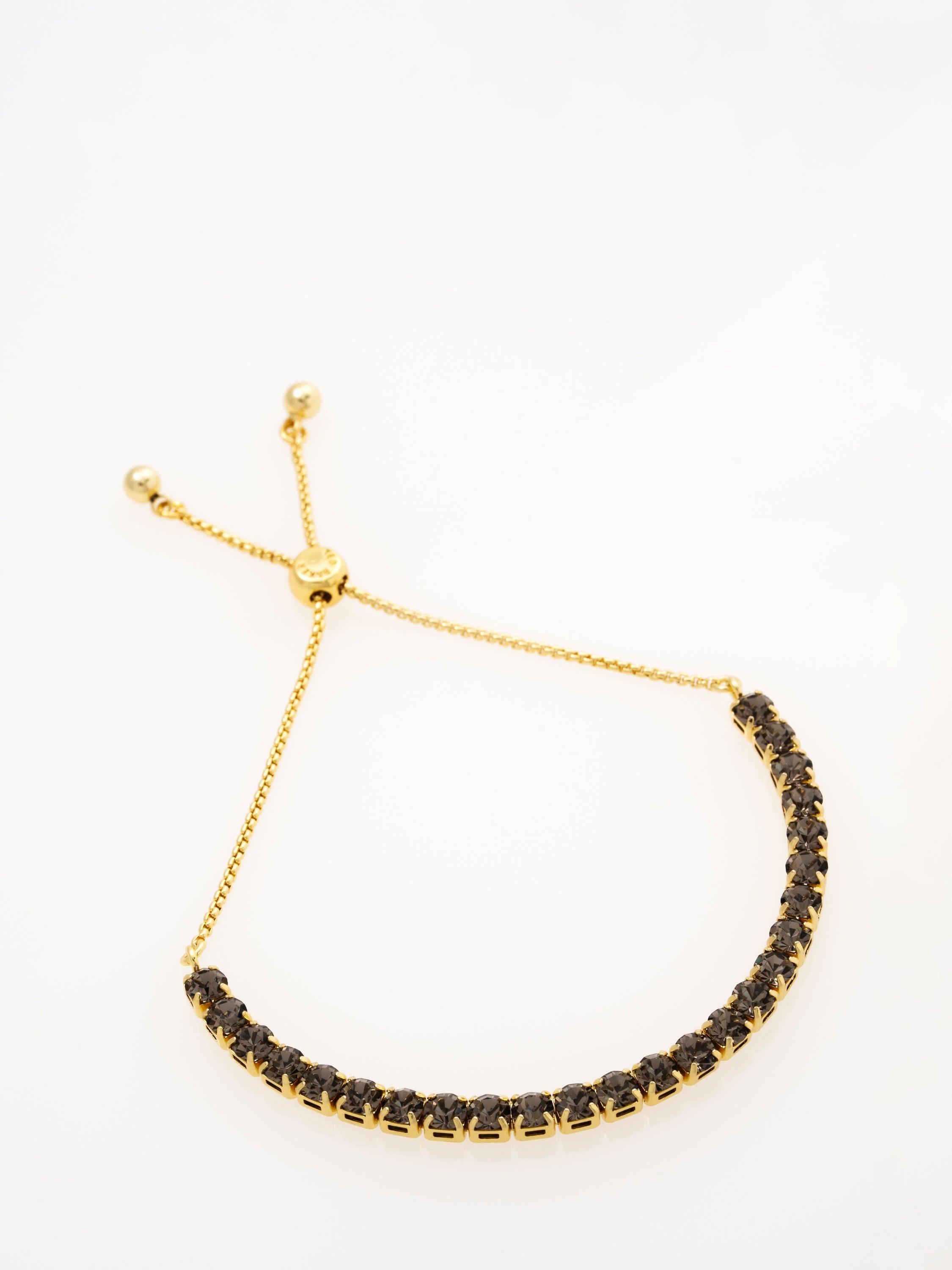 Product image 5 of 7, which shows Ted Baker Melrah Crystal Adjustable Tennis Bracelet, Gold/Black