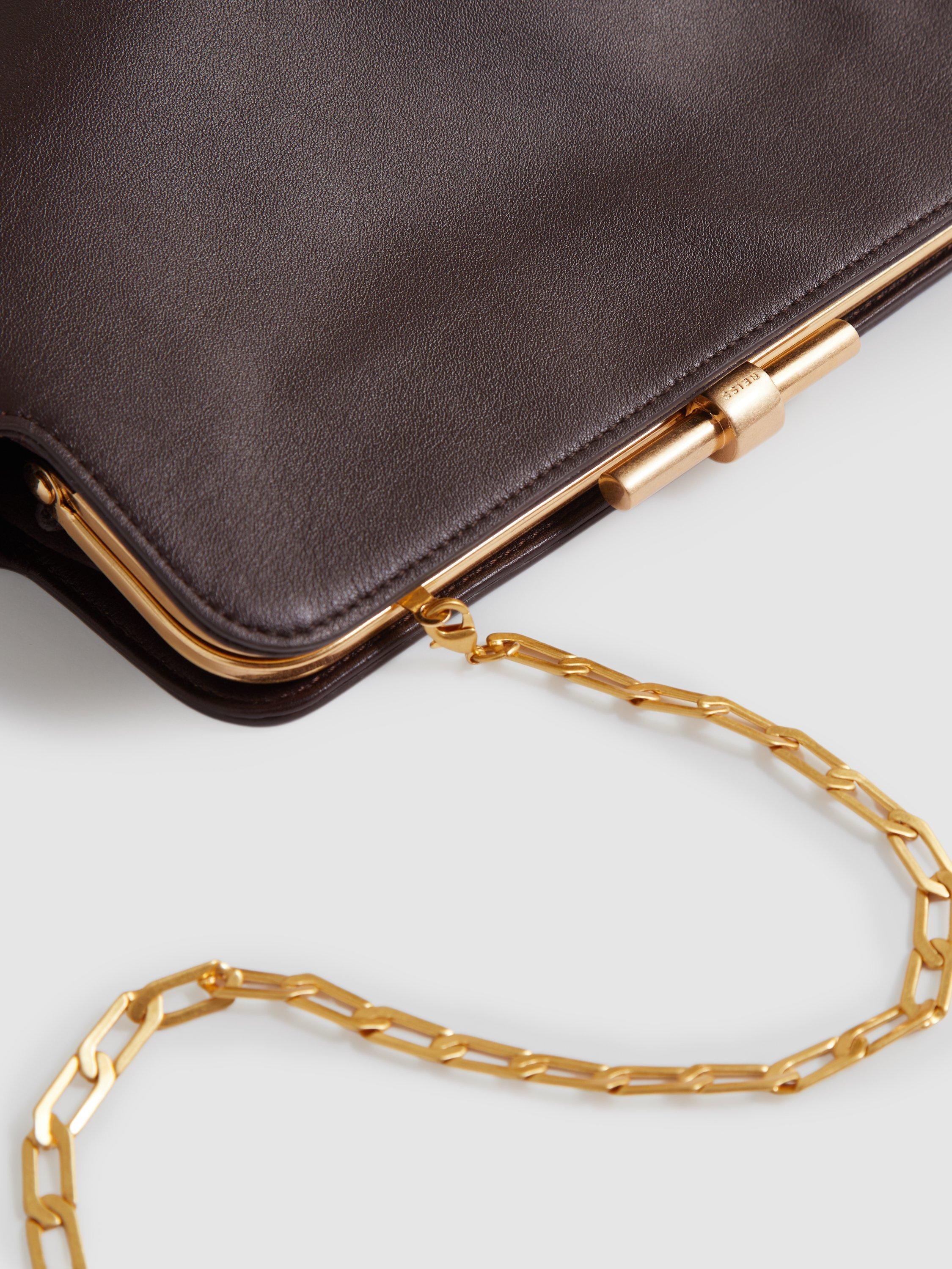 Product image 2 of 5, which shows Reiss Bethany Leather Clutch Bag, Burgundy