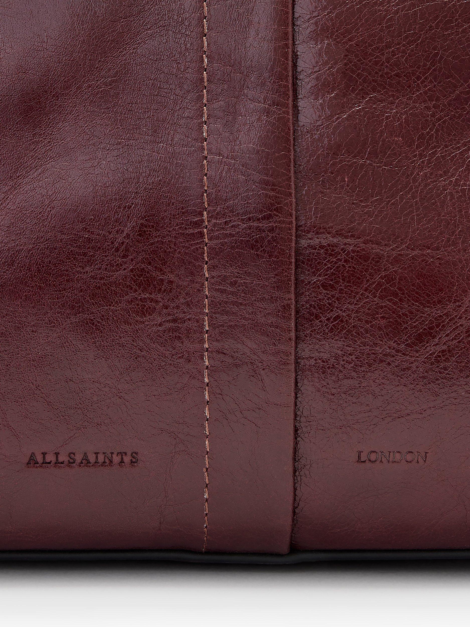 Product image 6 of 7, which shows AllSaints Ara Leather Tote Bag, Dark Red