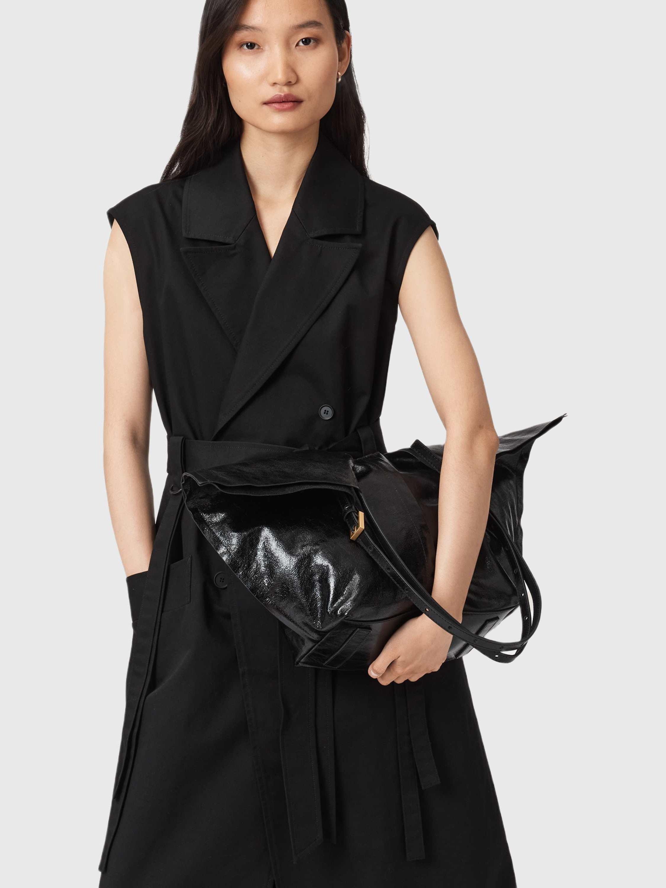 Product image 2 of 5, which shows AllSaints Ara Leather Tote Bag, Black