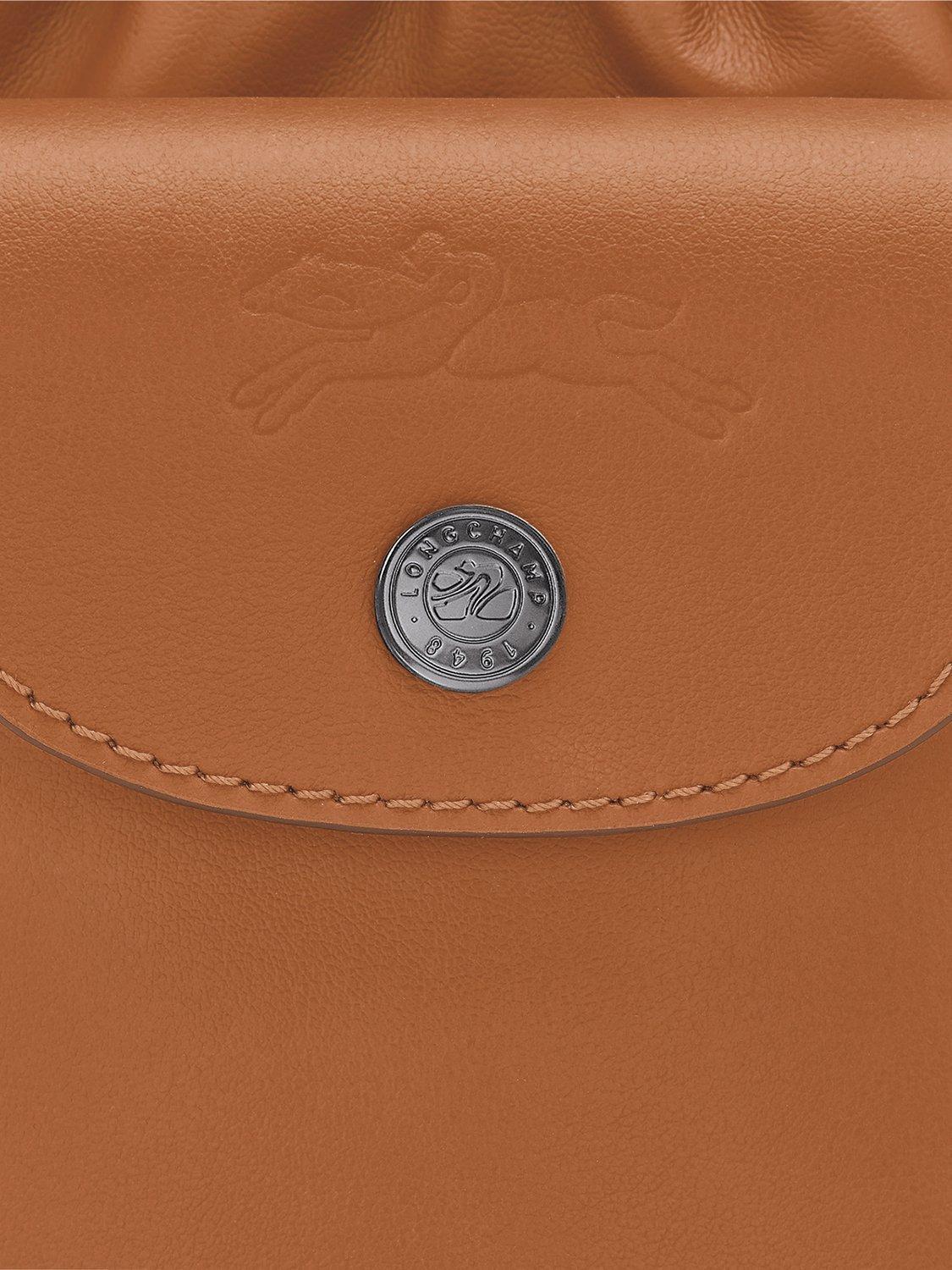 Product image 6 of 6, which shows Longchamp Pliage Extra Small Leather Bucket Bag, Cashew