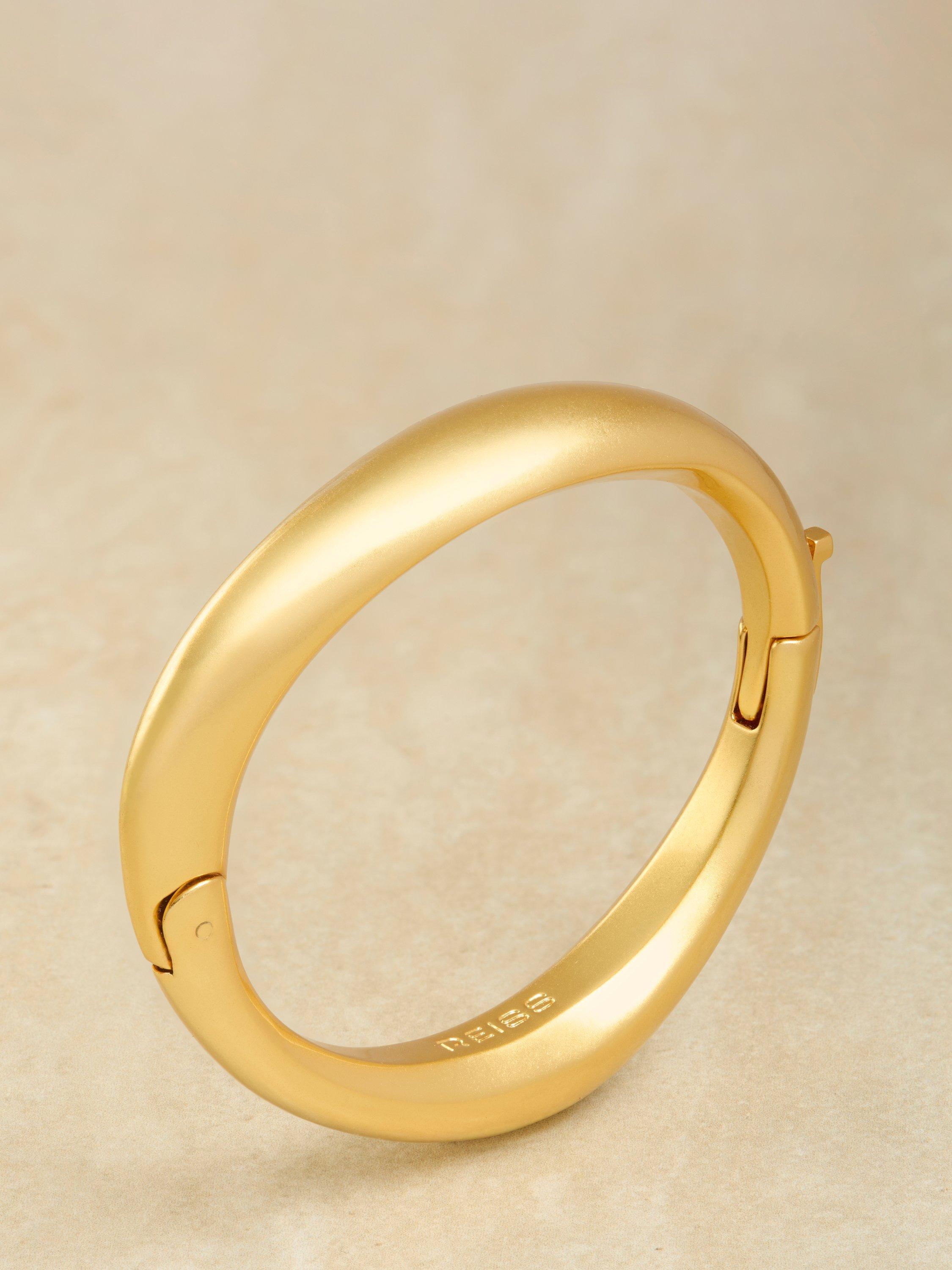 Product image 4 of 5, which shows Reiss Sierra Smooth Curved Hinged Bangle Bracelet, Gold