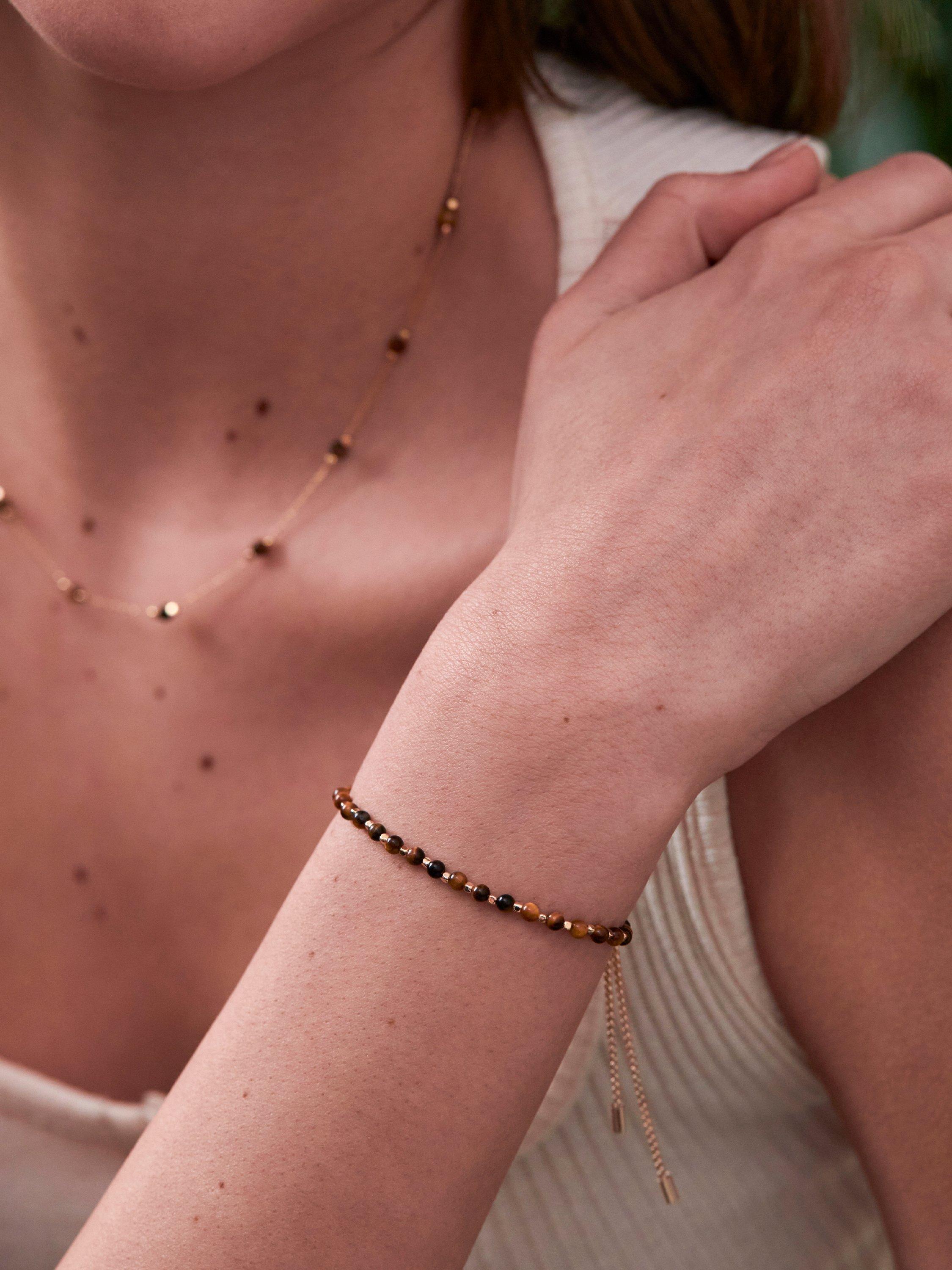 Product image 3 of 3, which shows Estella Bartlett Focus Tigers Eye Bracelet, Gold