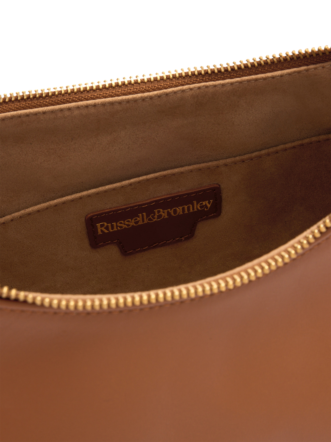 Product image 4 of 4, which shows Russell & Bromley Sutton Leather Medium Oval Shoulder Bag, Brown