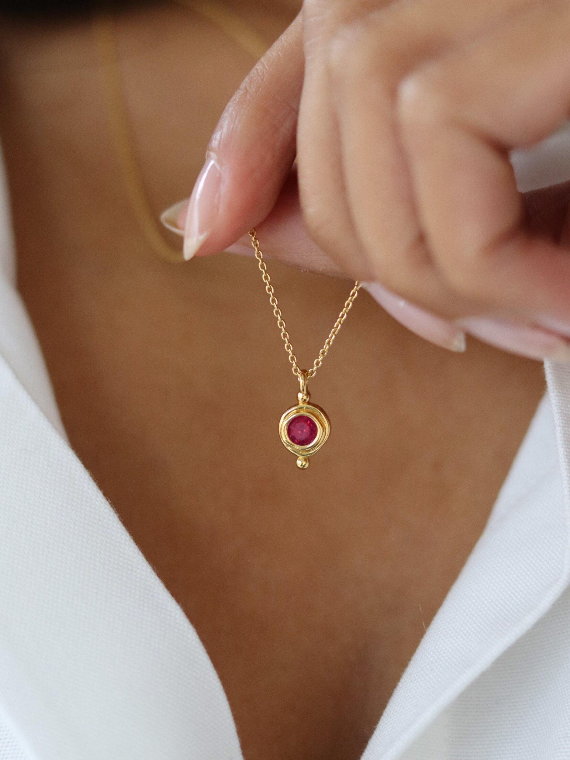 Product image 2 of 3, which shows Ottoman Hands July Birthstone Necklace