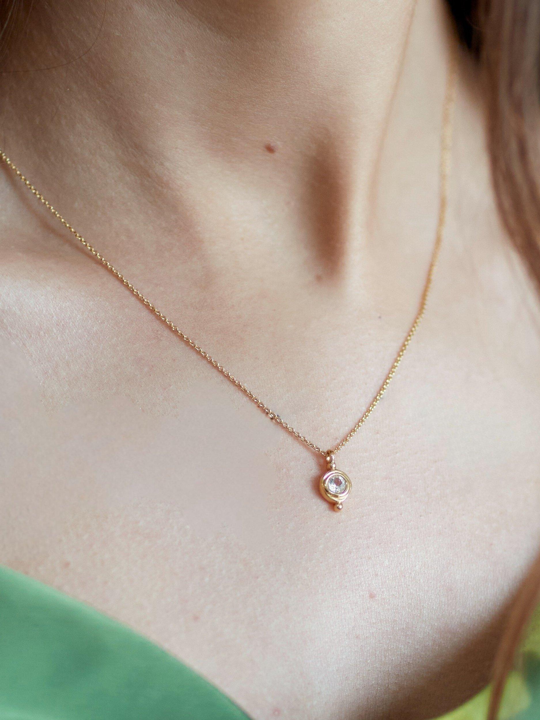 Product image 2 of 3, which shows Ottoman Hands April Birthstone Necklace