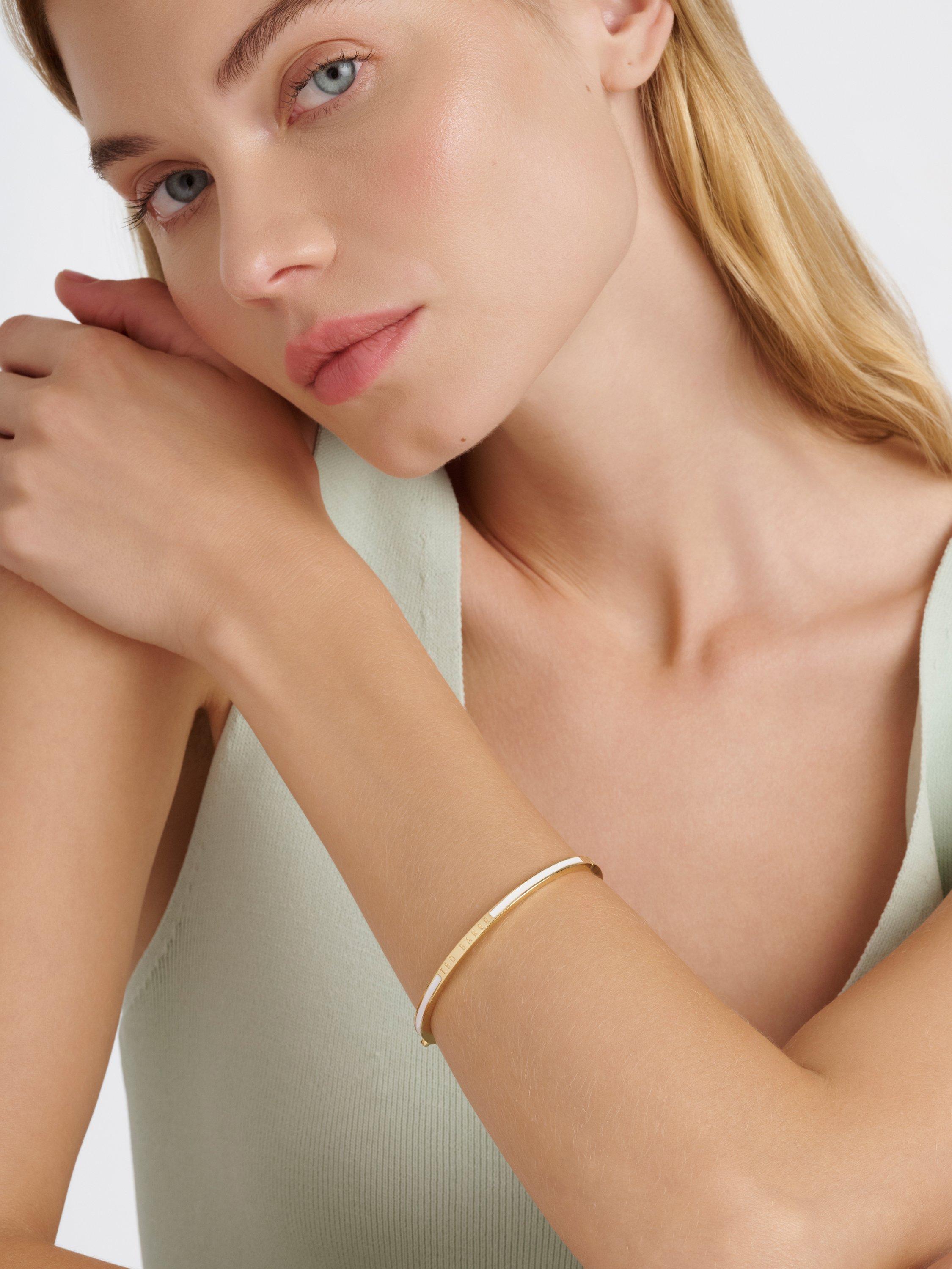 Product image 2 of 6, which shows Ted Baker Roley Classic Contour Enamel Slim Bangle Bracelet, Gold/White