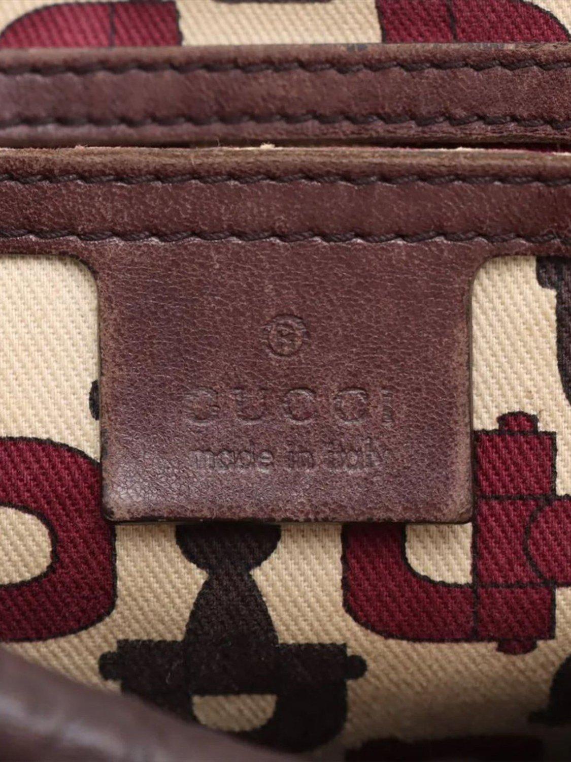 Product image 10 of 10, which shows Pre-loved GUCCI Guccissima Leather Top Handle Bag, Dark Brown