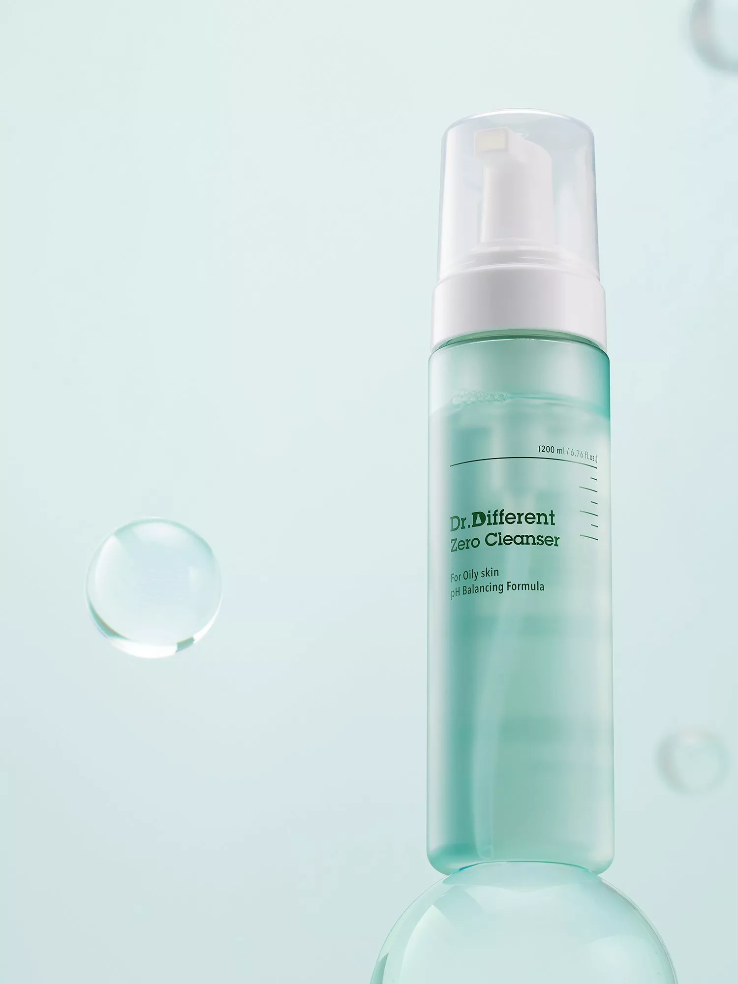 Dr. Different Zero Cleanser foaming bottle on pale blue background, skincare for oily skin, pH balancing formula