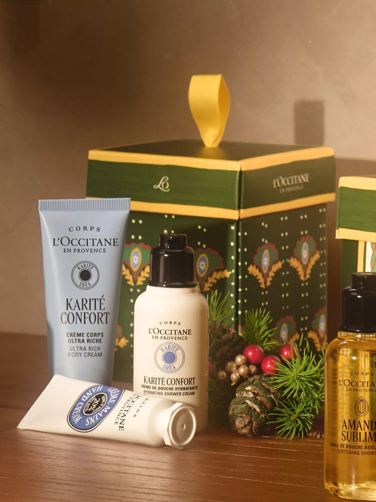 L’Occitane shea body care gift set with shower cream, hand cream and almond oil in festive green box