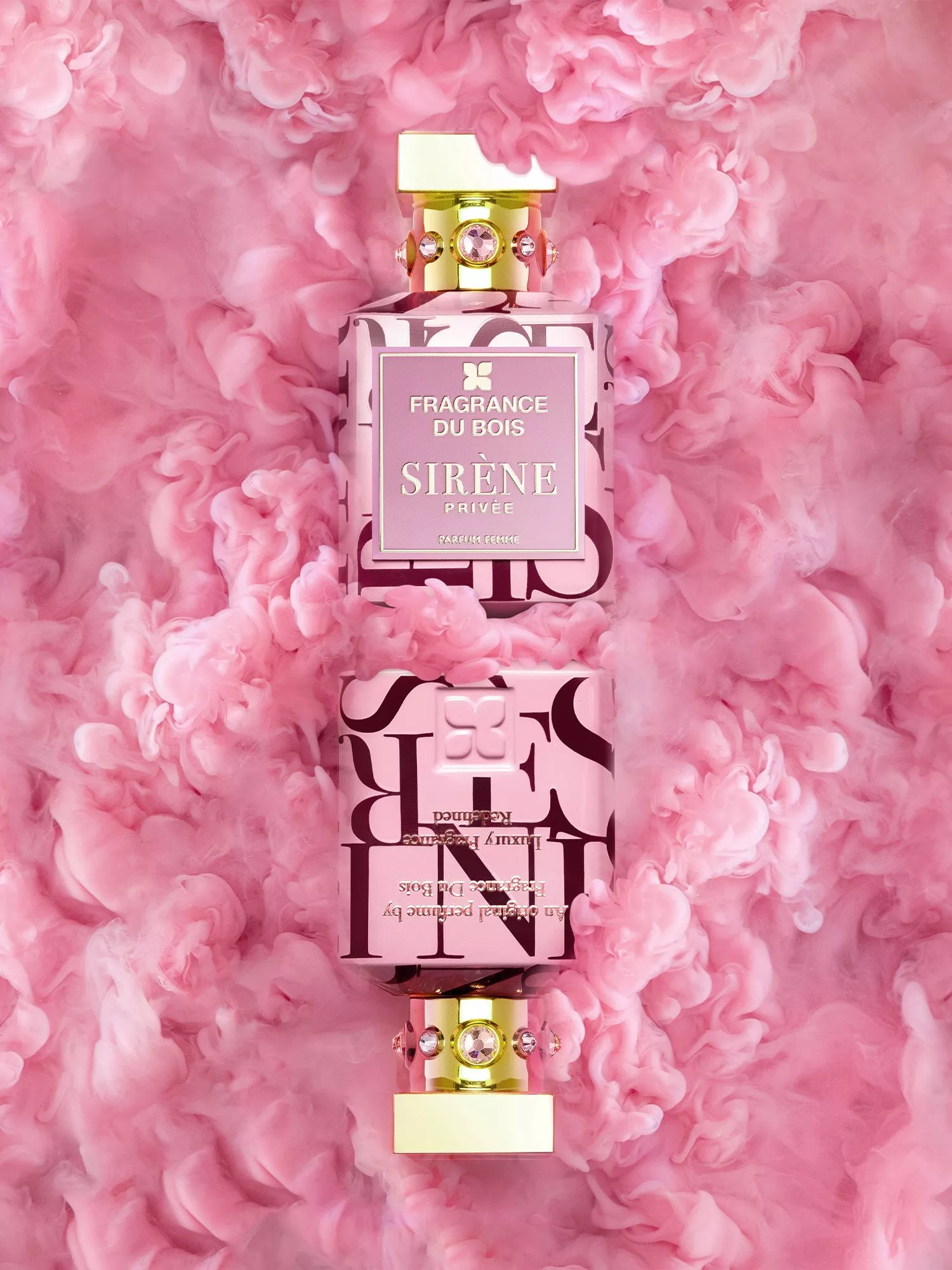 Fragrance Du Bois Sirène Privée perfume bottle with gold cap and pink smoke backdrop, luxury parfum femme shot