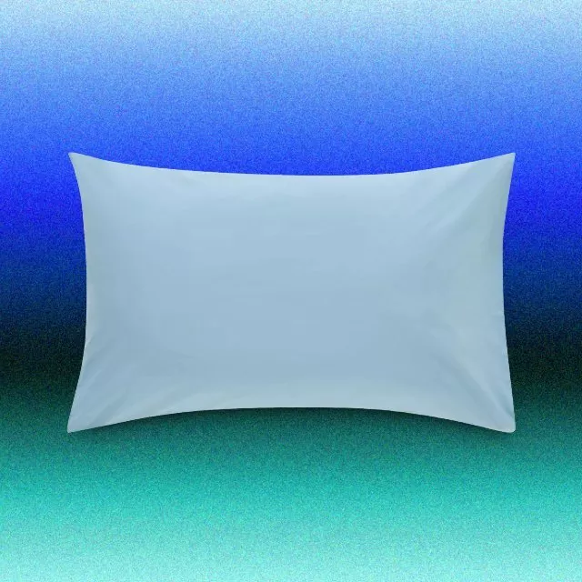 Plain white rectangular pillow with soft cotton pillowcase, studio product photo on blue gradient background