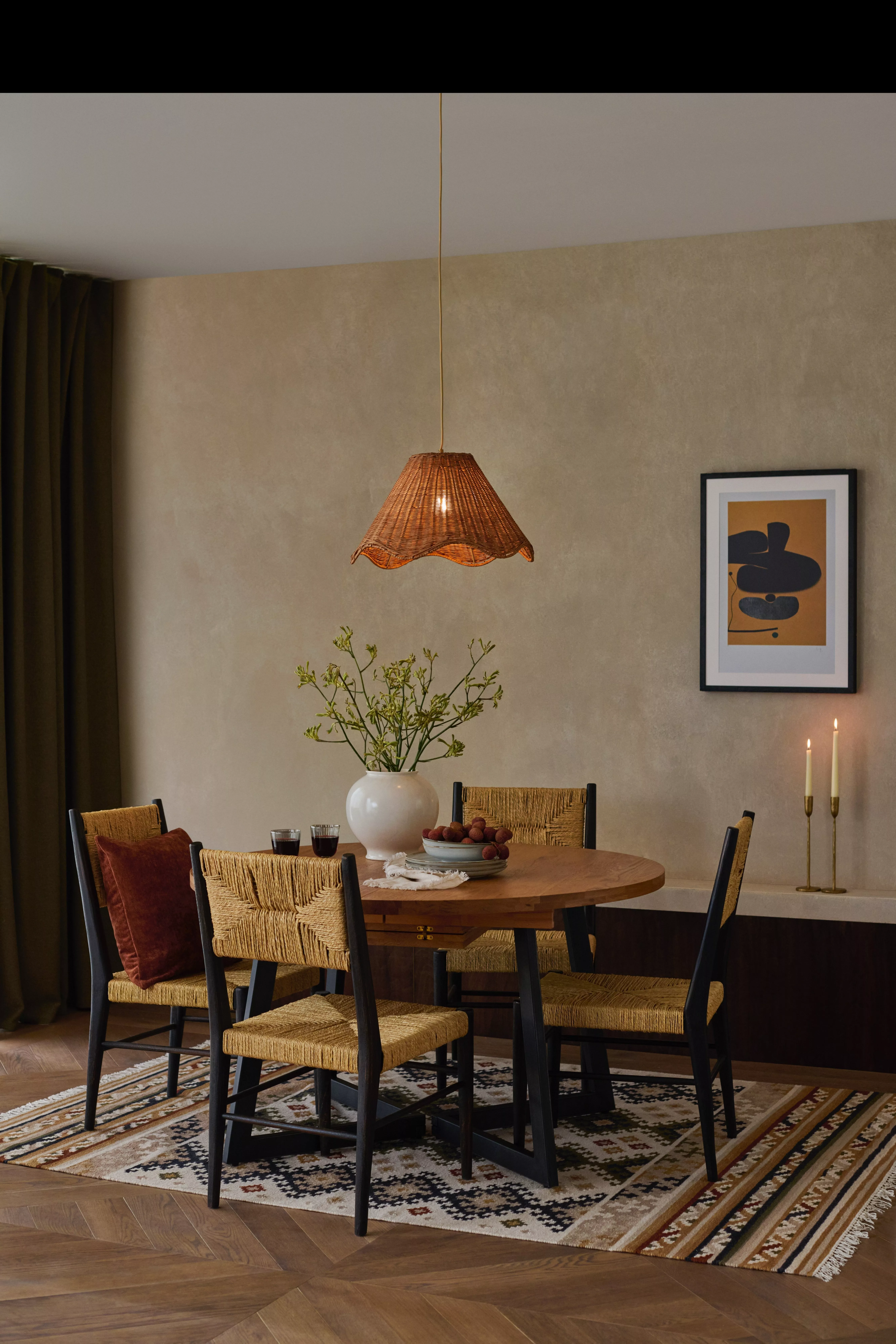 Marble dining room table laid with Christmas themed decorations, plates and cutlery