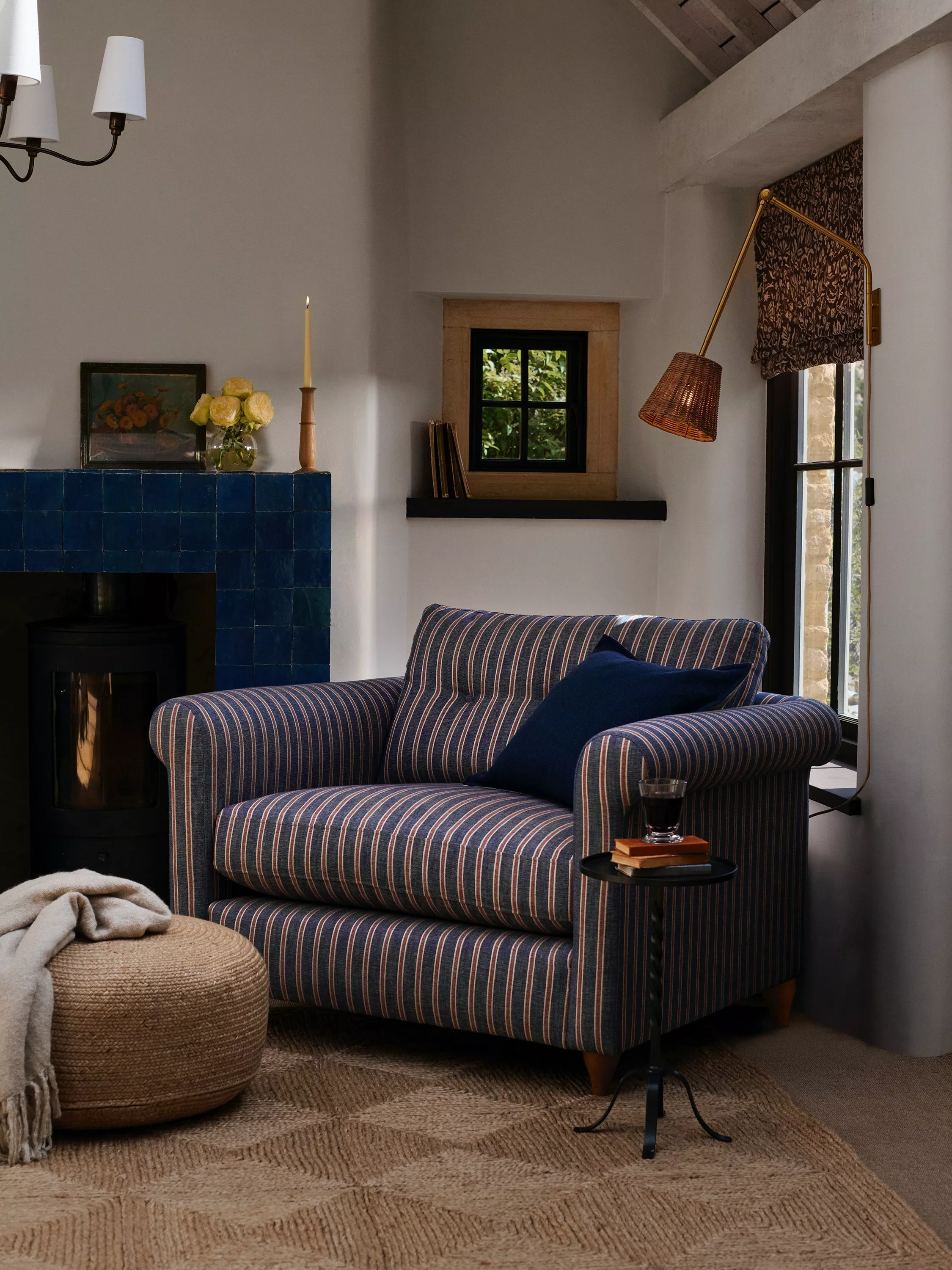 Grey sofa with button detail seat and back cushions and wooden legs 