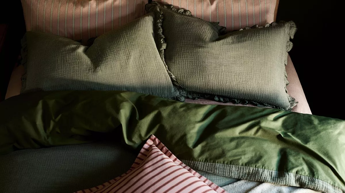 Duvet and pillows with green and pink bedding