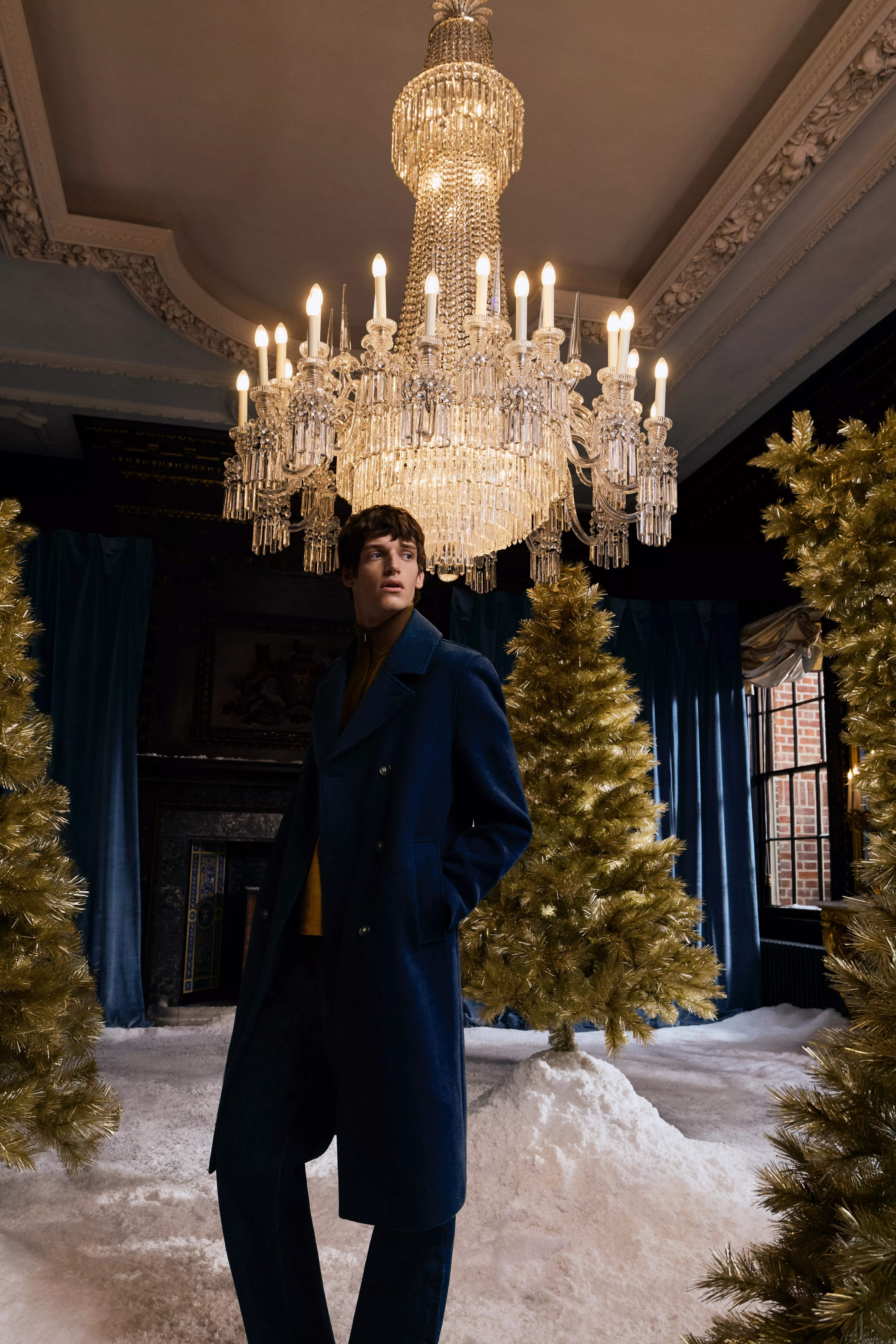 Man wearing a navy tailored coat 