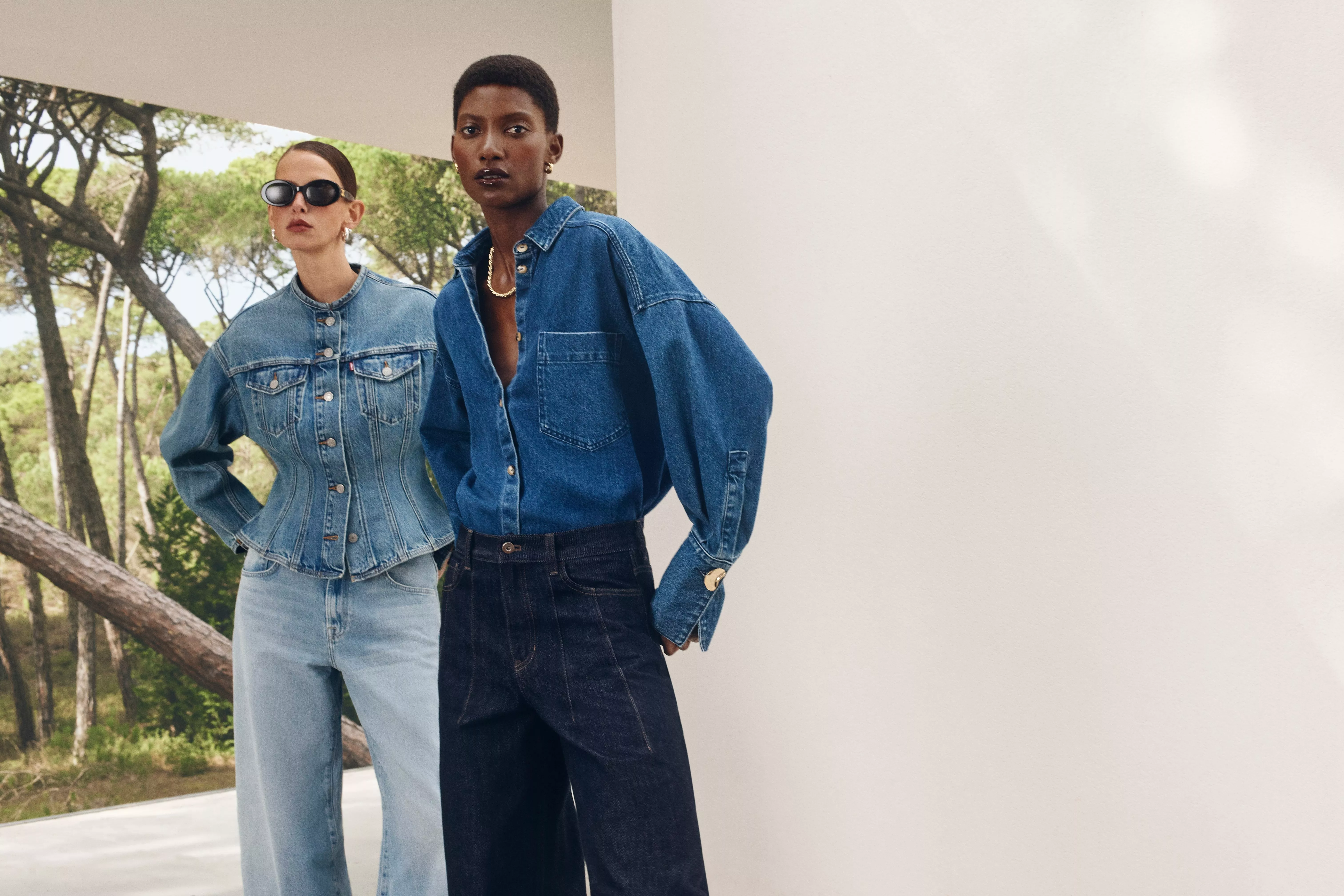 two women wearing all denim outfits