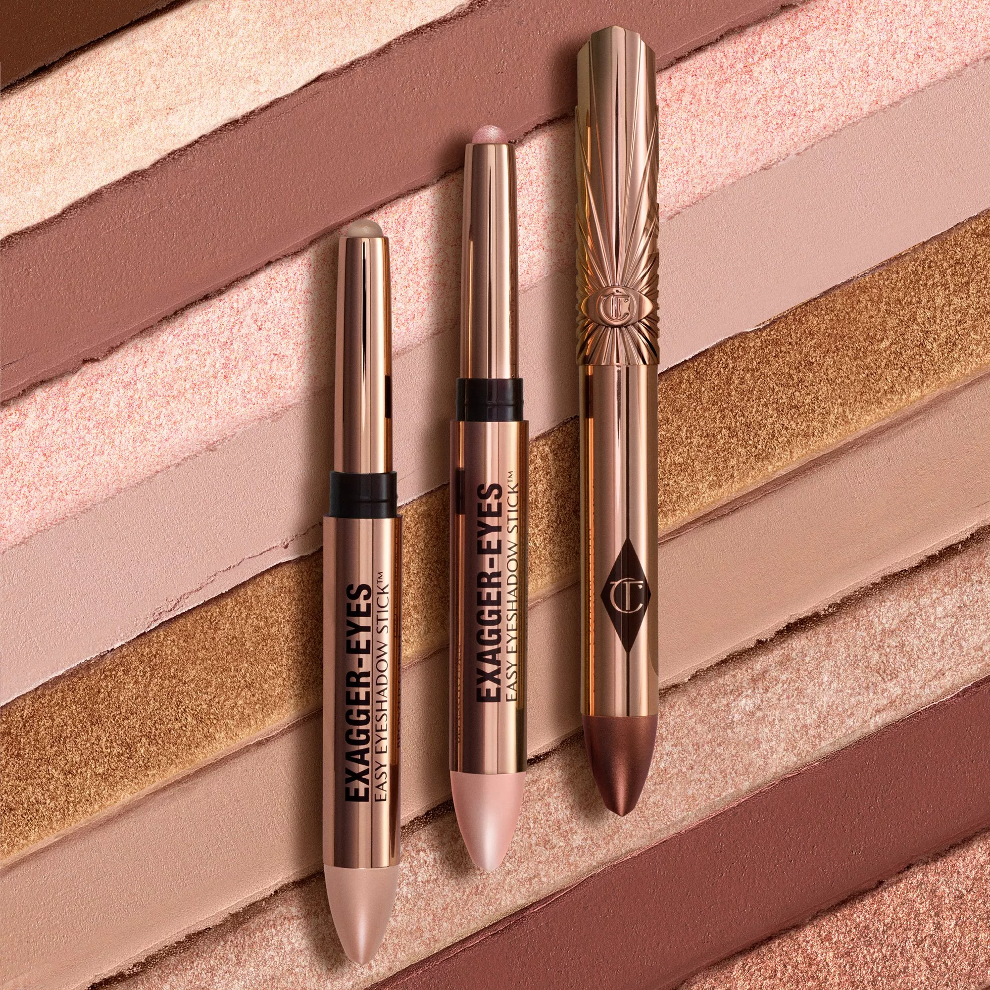 Rose gold eyeshadow sticks on nude shimmer makeup swatches, featuring Exagger-Eyes easy eyeshadow crayons