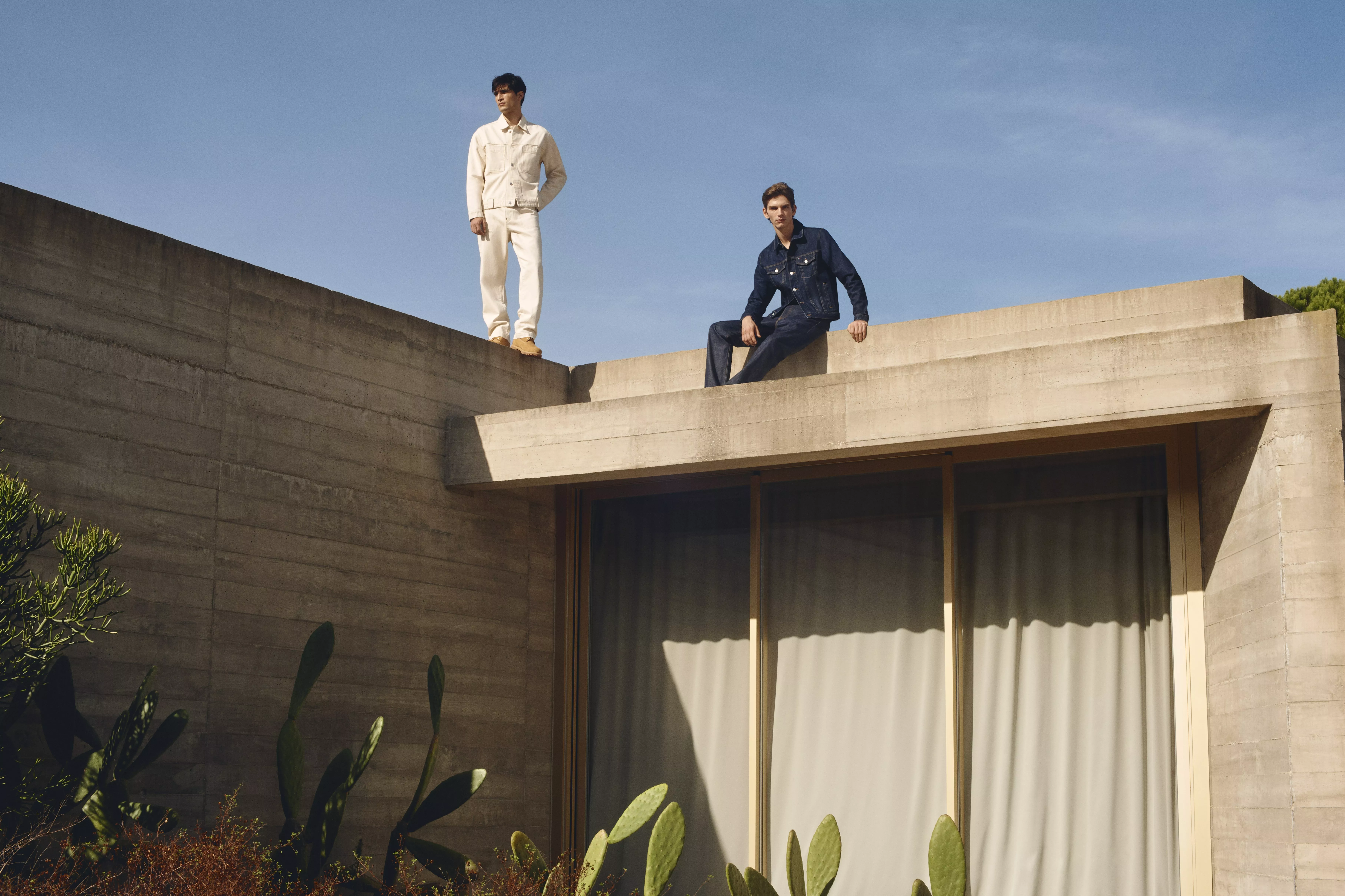 Two men both dressed in double denim outfits