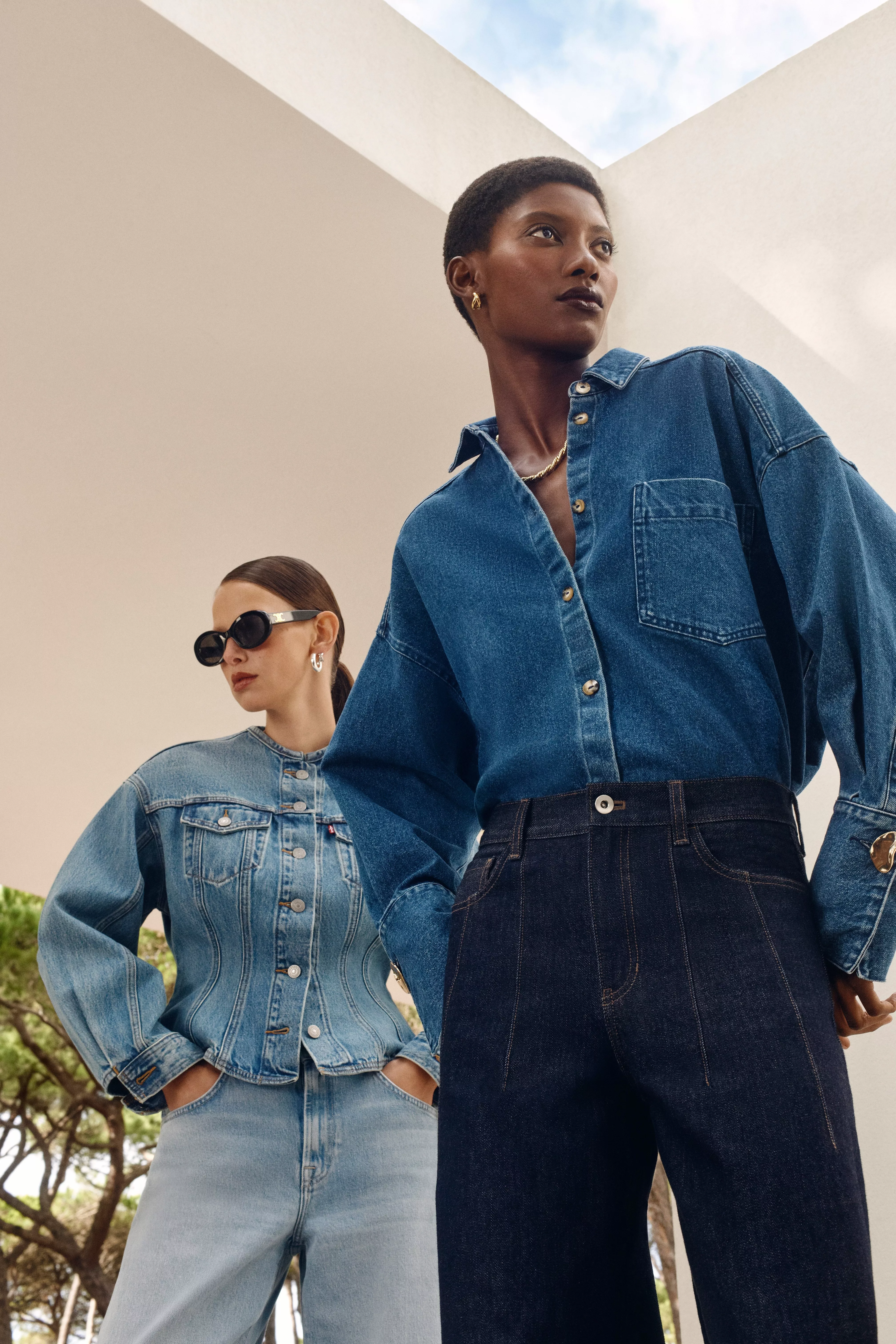 two women wearing double denim outfits