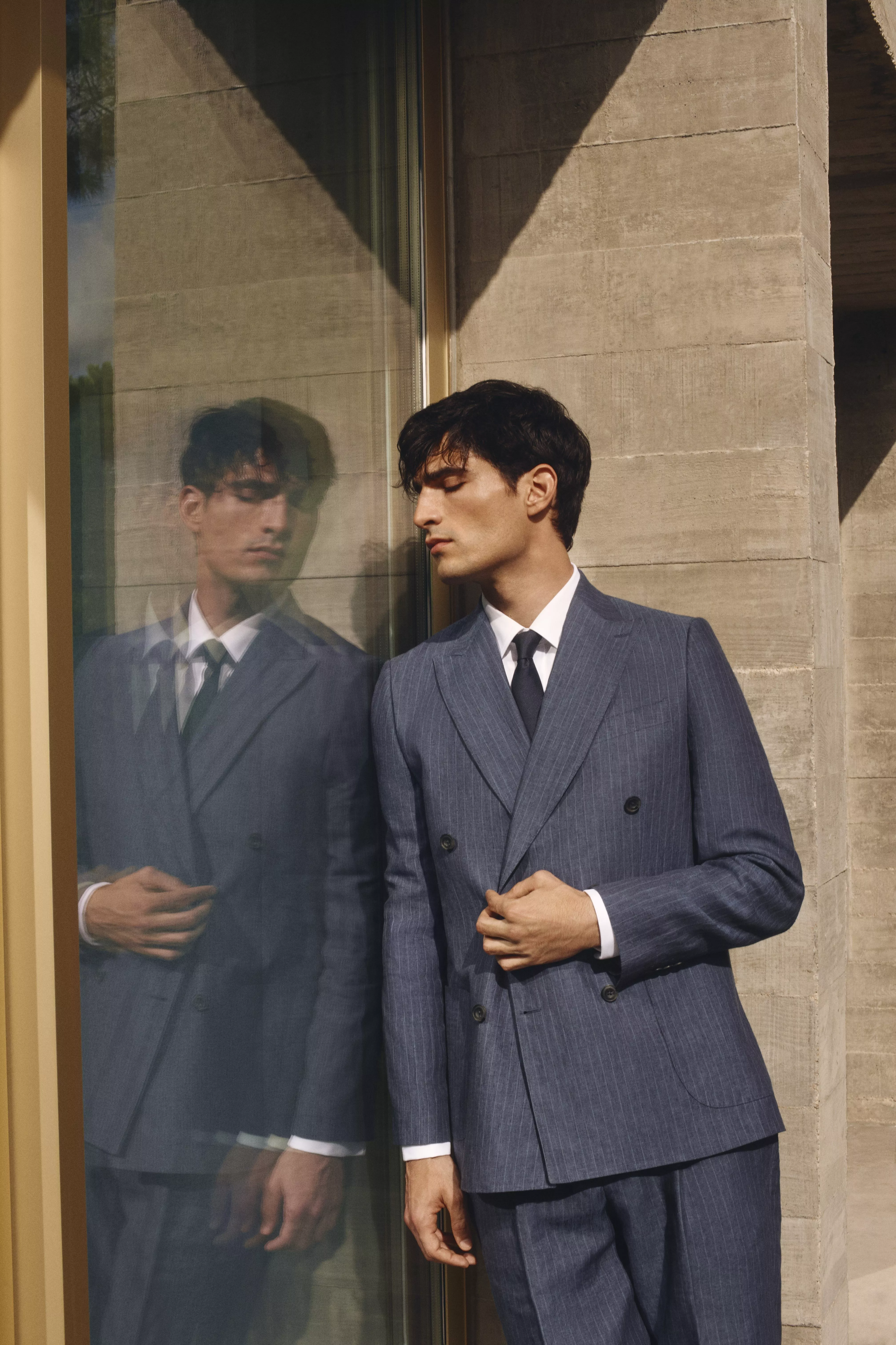 Man wearing pinstripe double breasted suit
