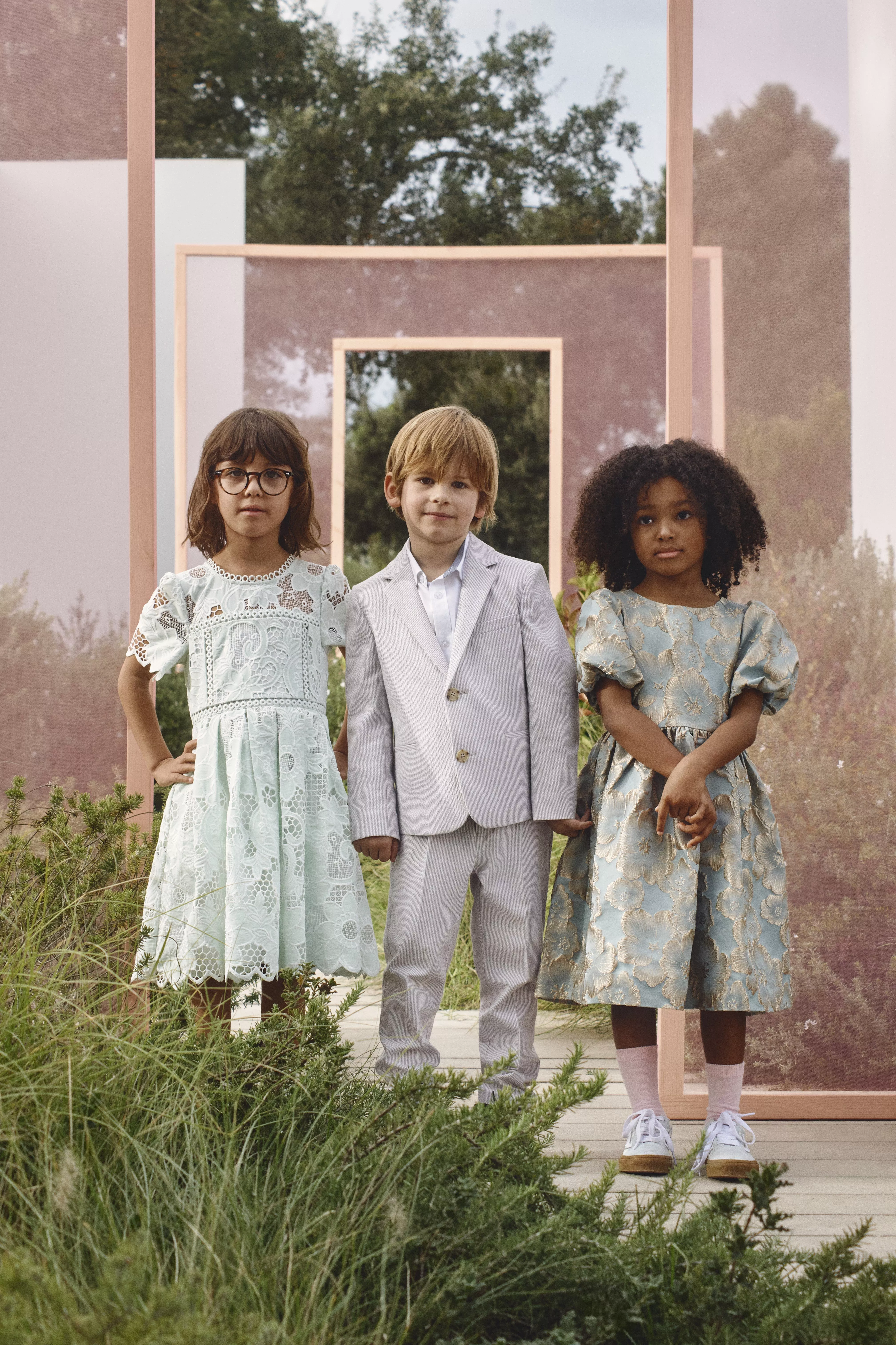 three children wearing smart formalwear