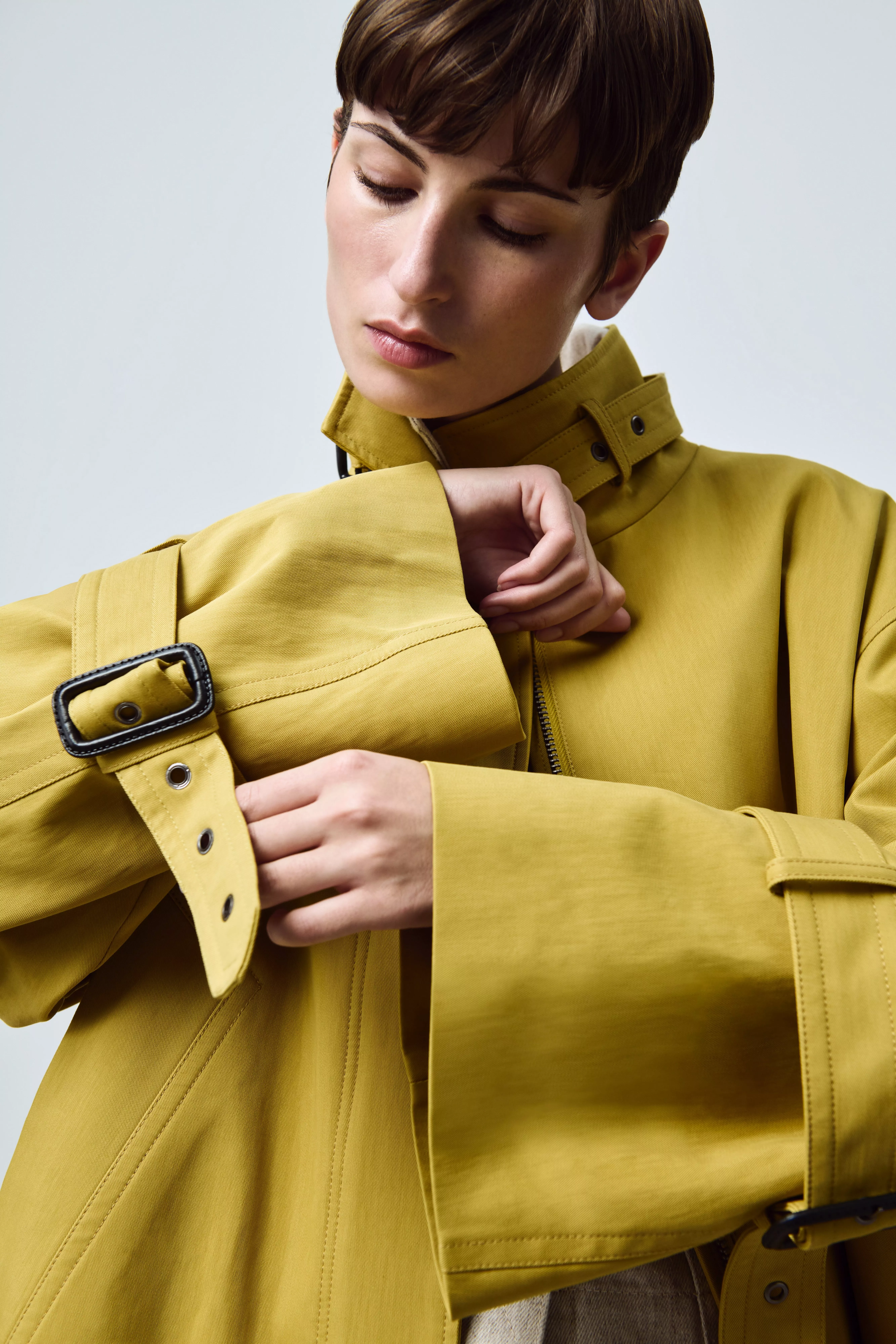 woman wearing a silver earring and bracelet with watch