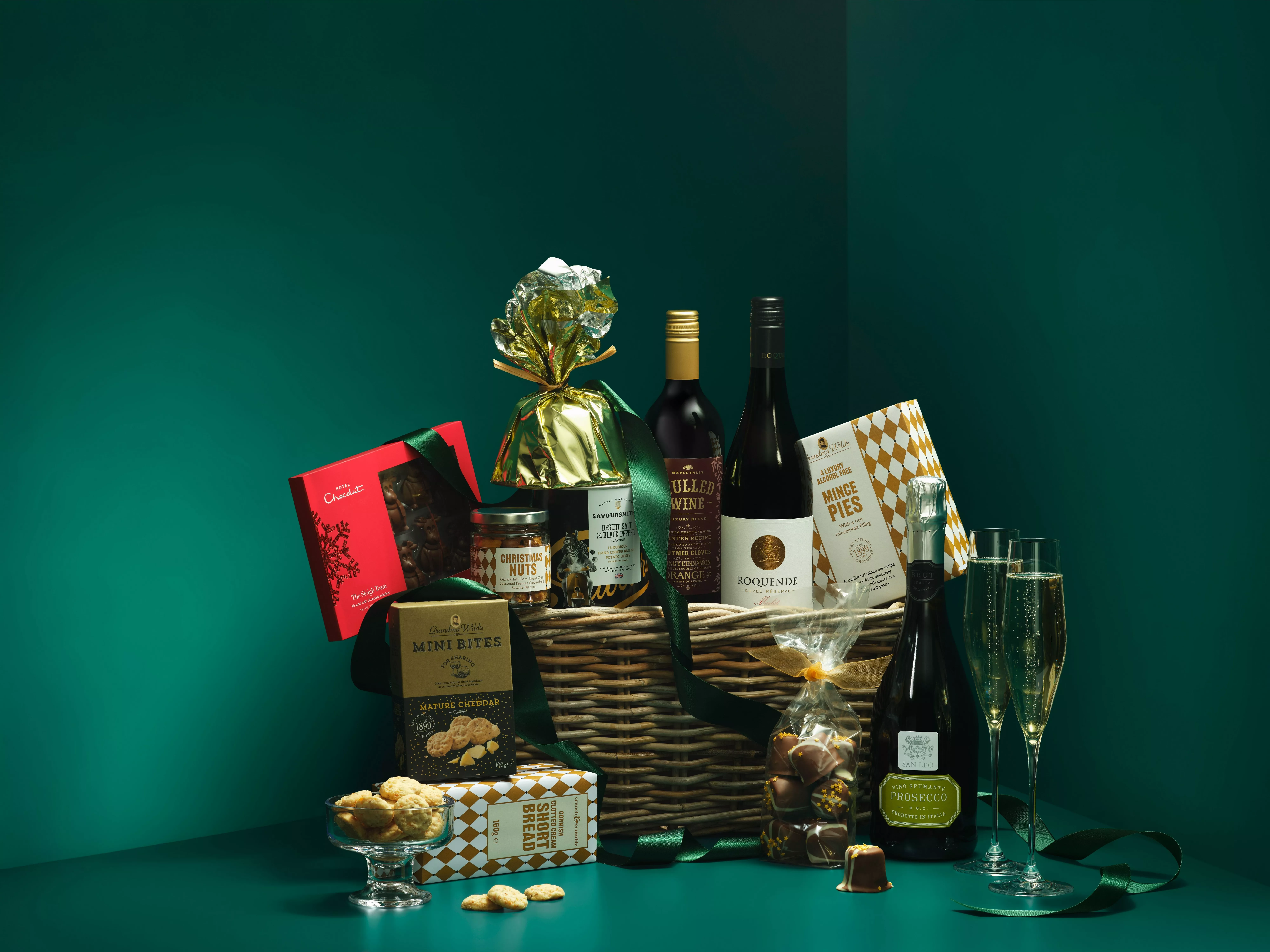 Luxury Christmas hamper gift basket with Prosecco, red wine, mince pies, chocolates and festive snacks