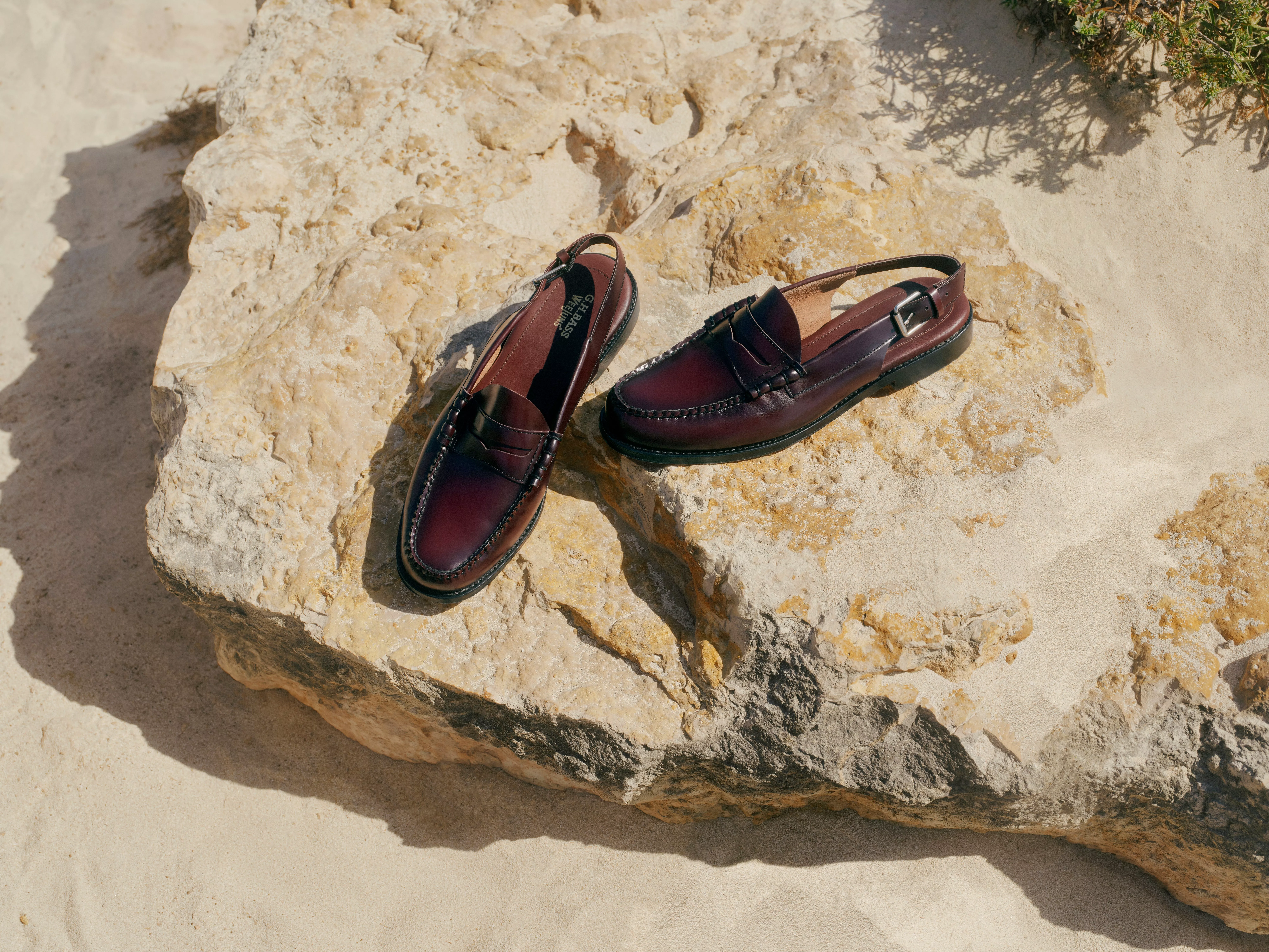 Burgundy leather slingback loafers on sunlit rock, stylish men’s summer shoes for smart casual wear
