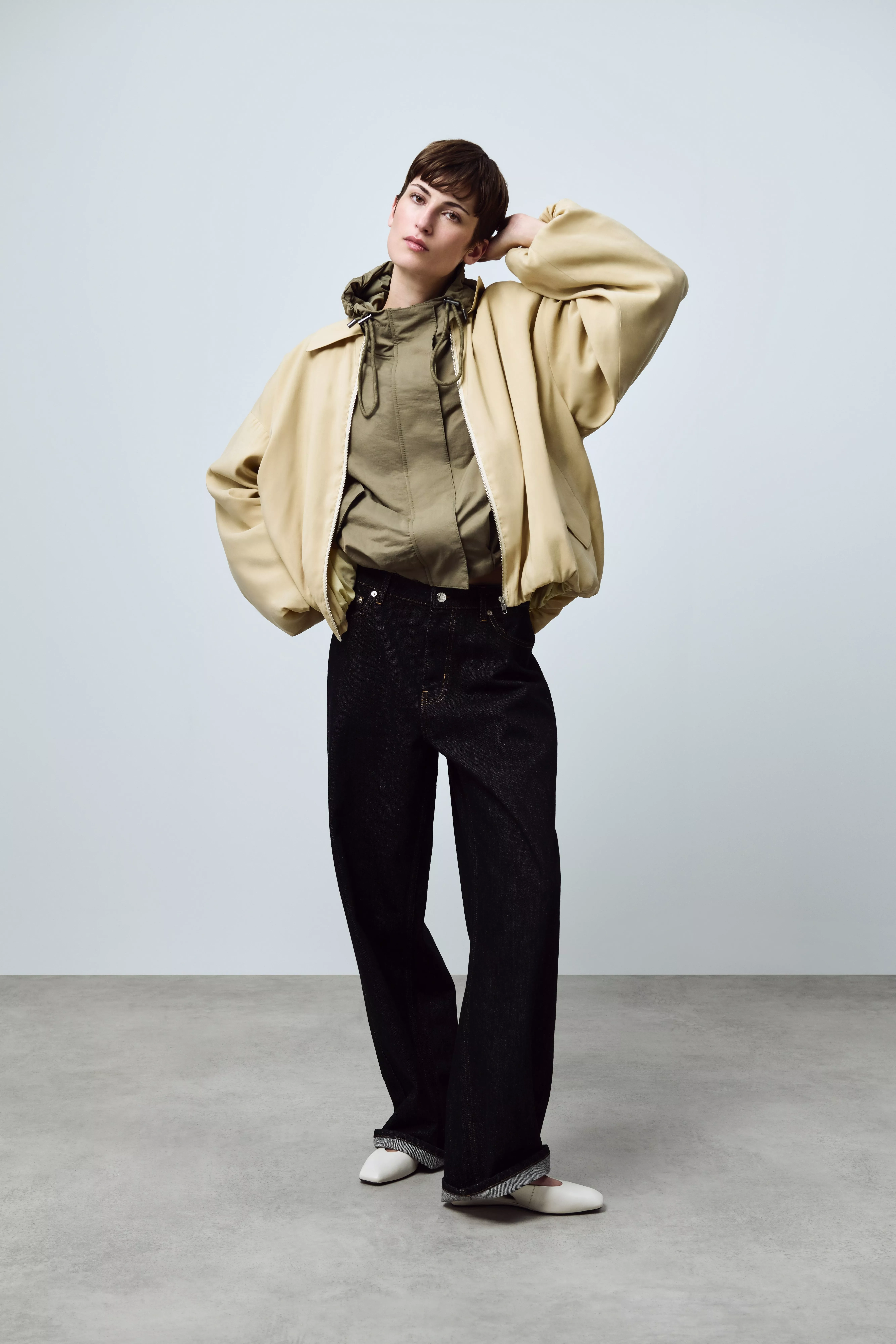 woman in a windbreaker and jeans