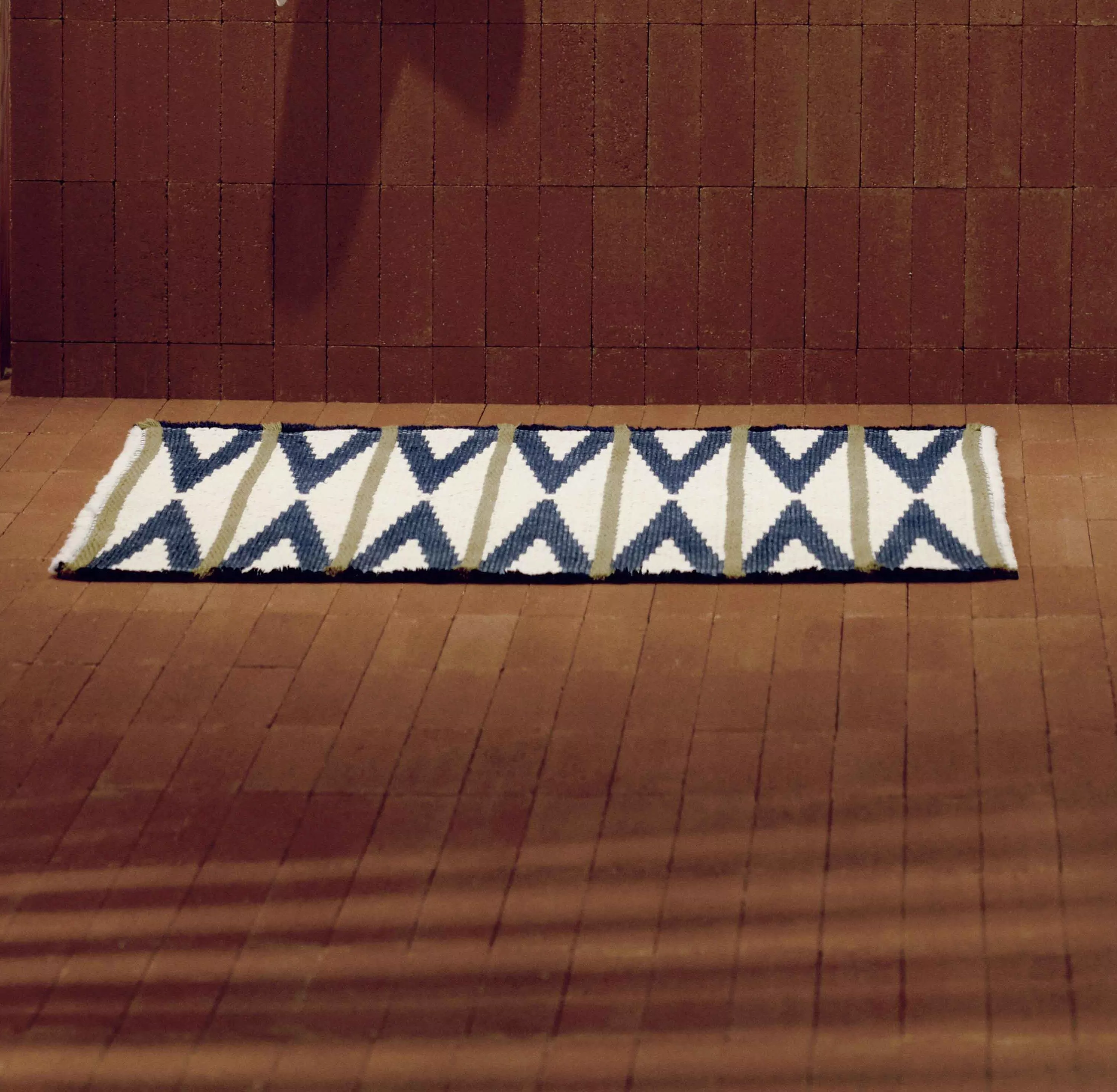 Beige bath mat on the floor 