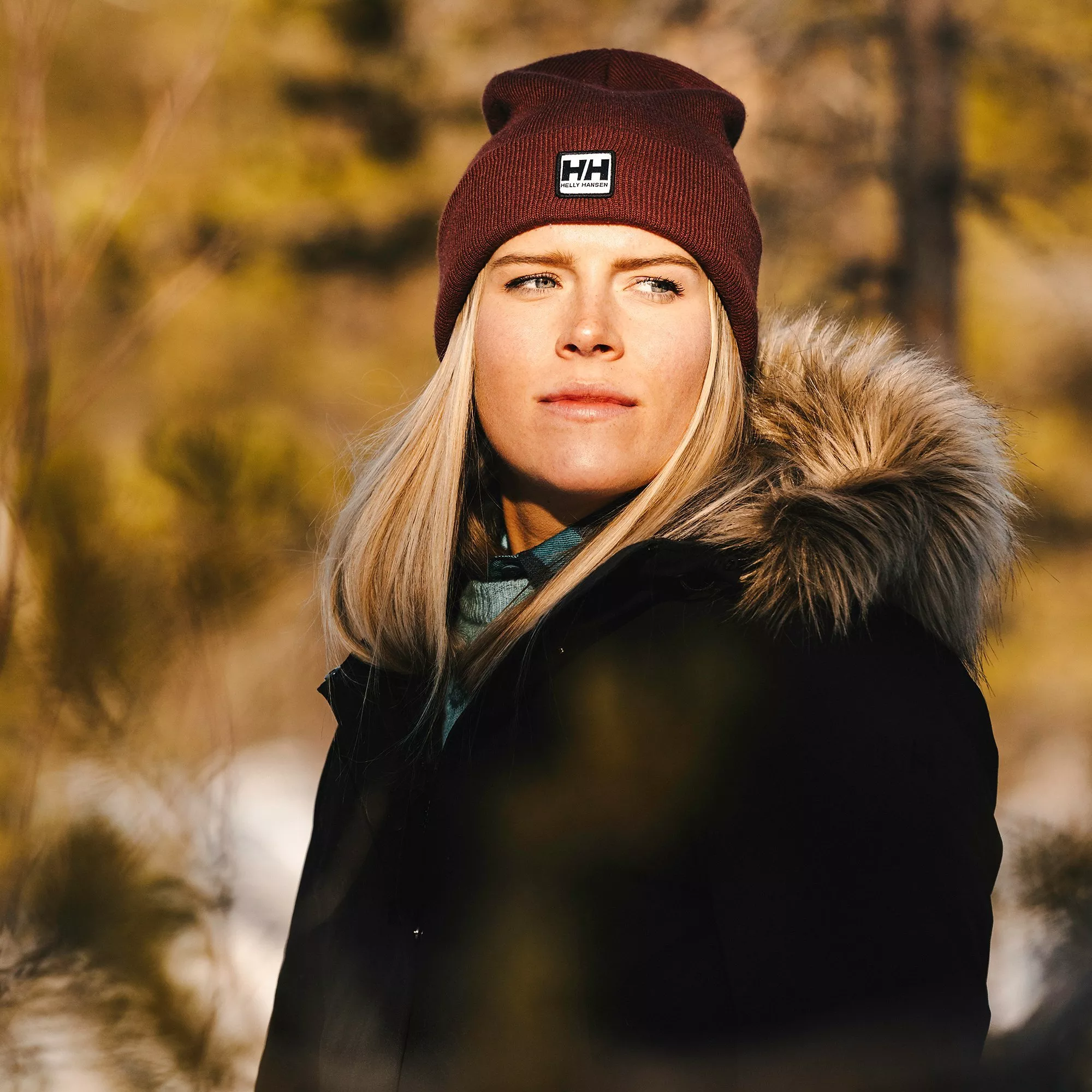 woman wearing a helly hansen brand hat and coat