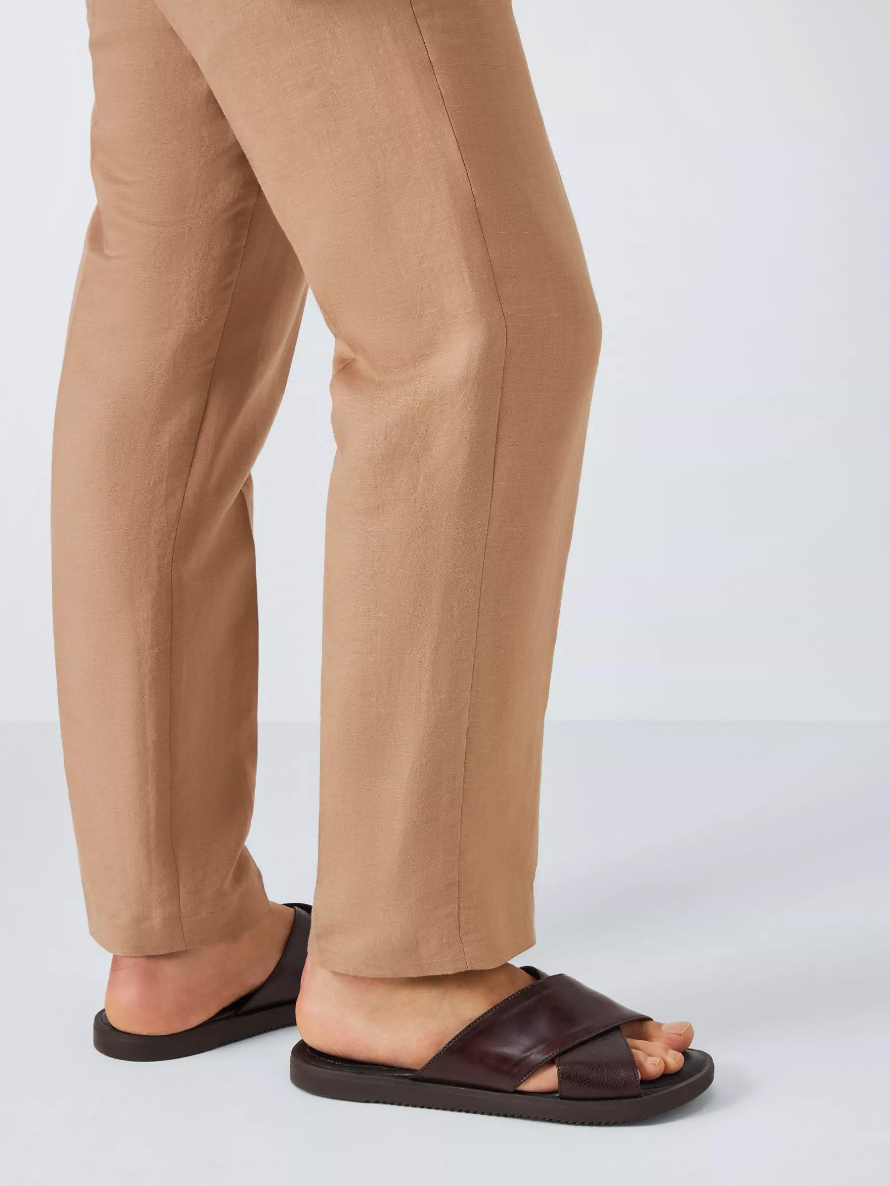 Man in brown sandals, leather cross strap